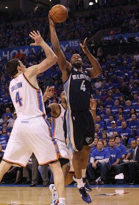 OKLAHOMA CITY, OK - MAY 01:  Forward Sam Young #4 of the Memphis Grizzlies takes a shot against Nick Collison #4 of the Oklahoma City Thunder in Game One of the Western Conference Semifinals in the 2011 NBA Playoffs on May 1, 2011 at Oklahoma City Arena i