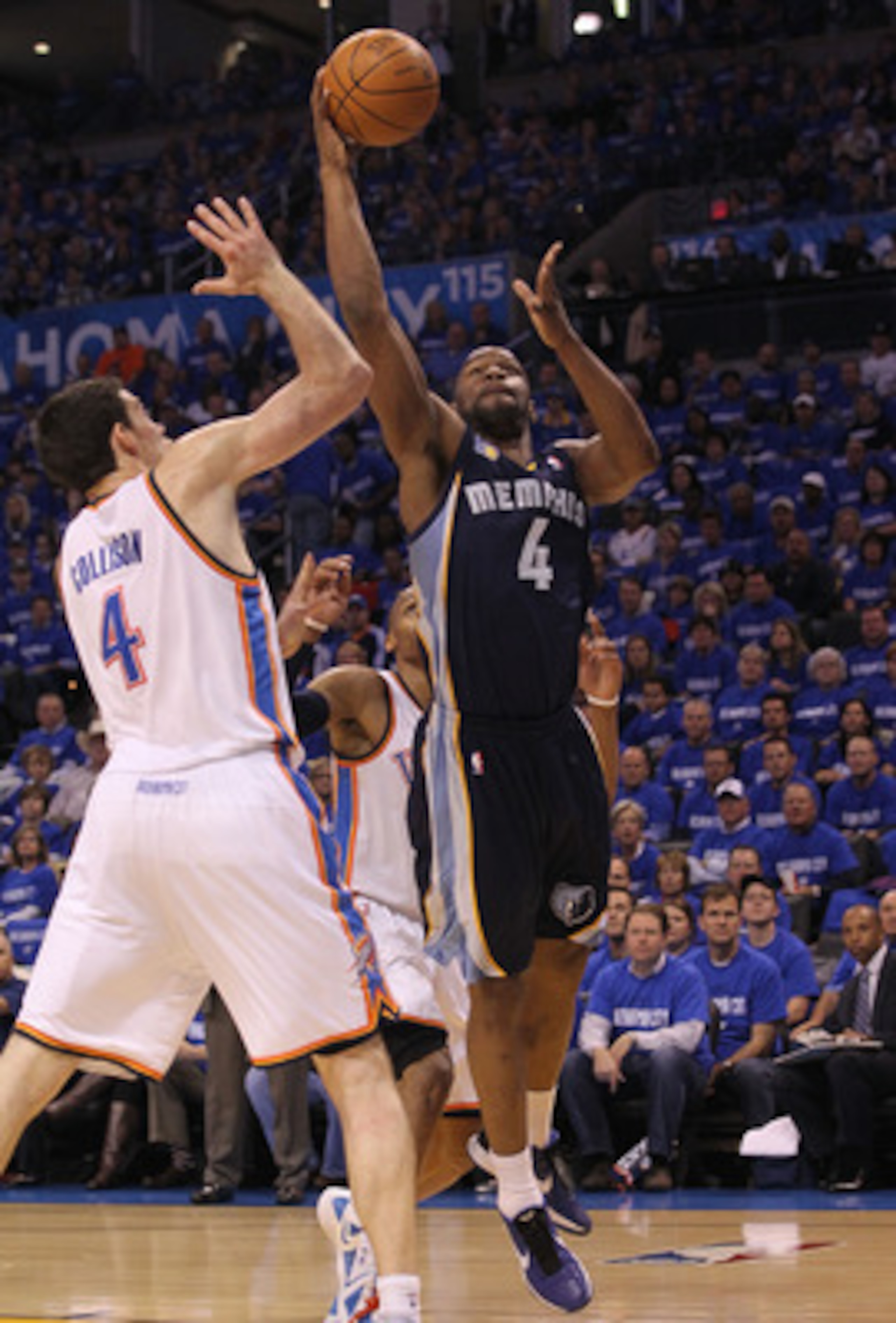OKLAHOMA CITY, OK - MAY 01:  Forward Sam Young #4 of the Memphis Grizzlies takes a shot against Nick Collison #4 of the Oklahoma City Thunder in Game One of the Western Conference Semifinals in the 2011 NBA Playoffs on May 1, 2011 at Oklahoma City Arena i