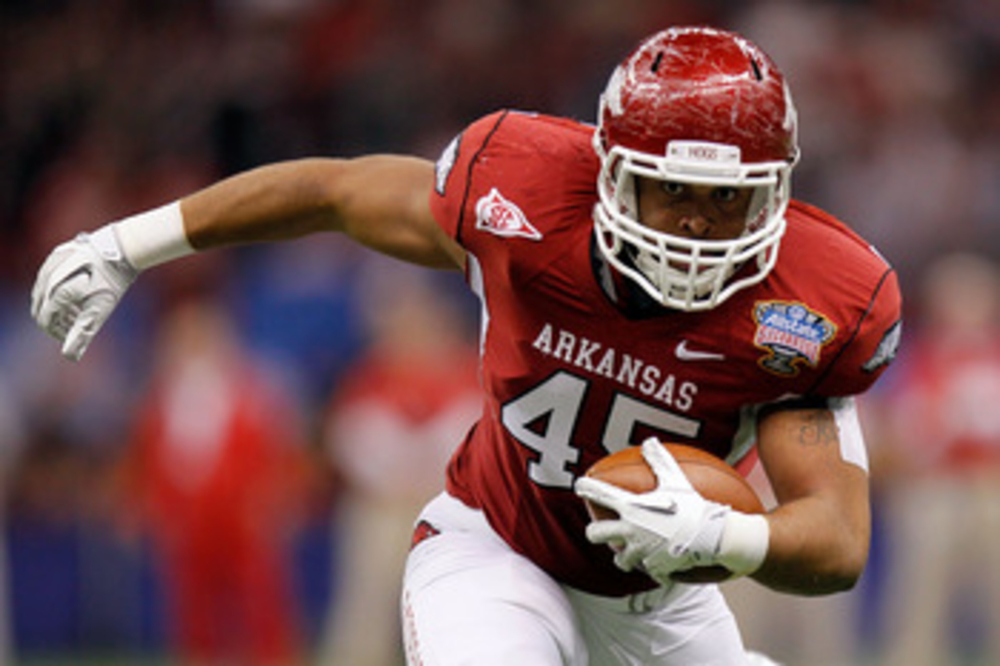 NEW ORLEANS, LA - JANUARY 04:  D.J. Williams #45 of the Arkansas Razorbacks runs after a catch in the first half against the Ohio State Buckeyes during the Allstate Sugar Bowl at the Louisiana Superdome on January 4, 2011 in New Orleans, Louisiana.  (Phot
