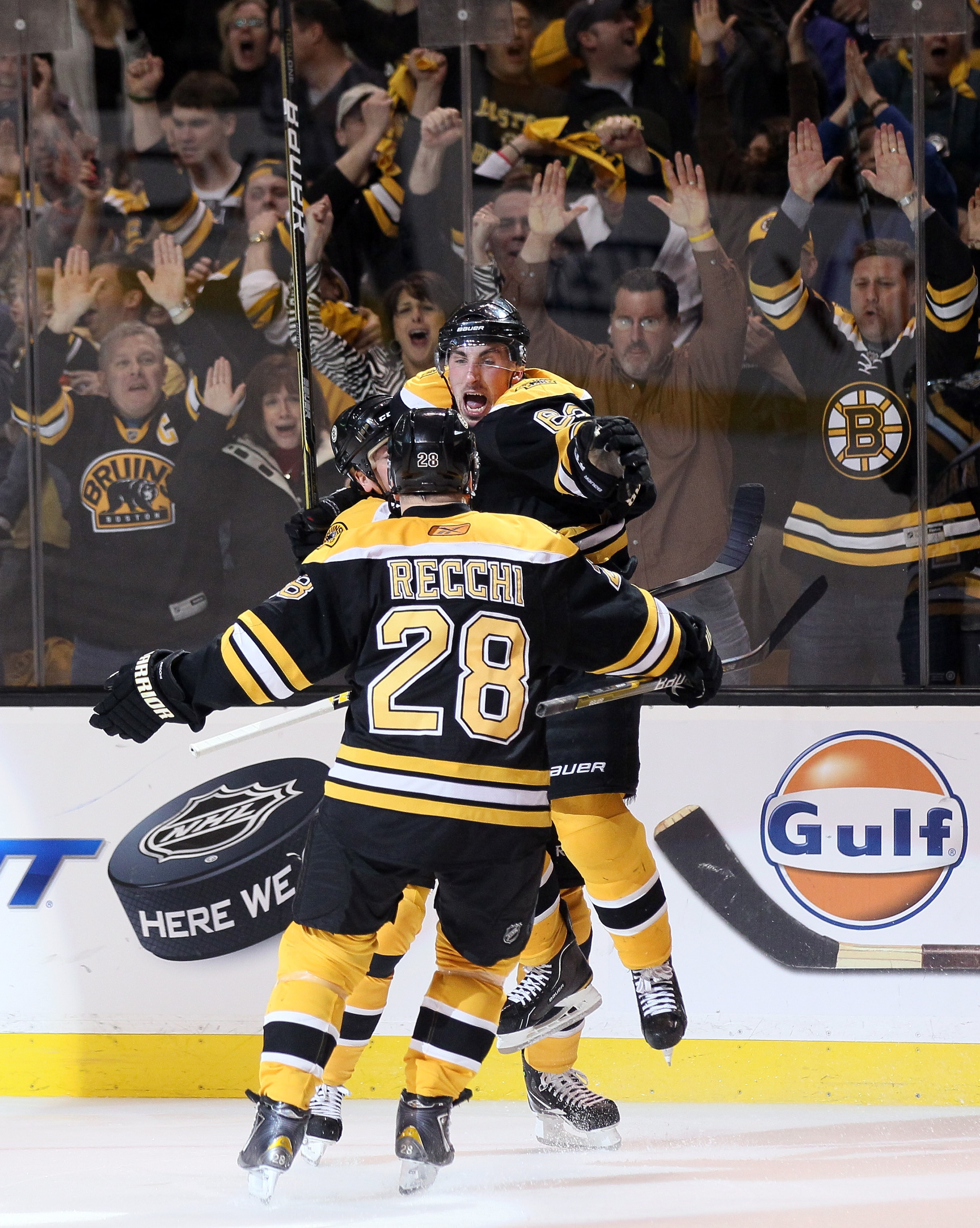 BOSTON, MA - APRIL 23:  Brad Marchand #63 of the Boston Bruins celebrates his goal with teammates Mark Recchi #28 and Patrice Bergeron #37  in Game Five of the Eastern Conference Quarterfinals during the 2011 NHL Stanley Cup Playoffs at TD Garden on April