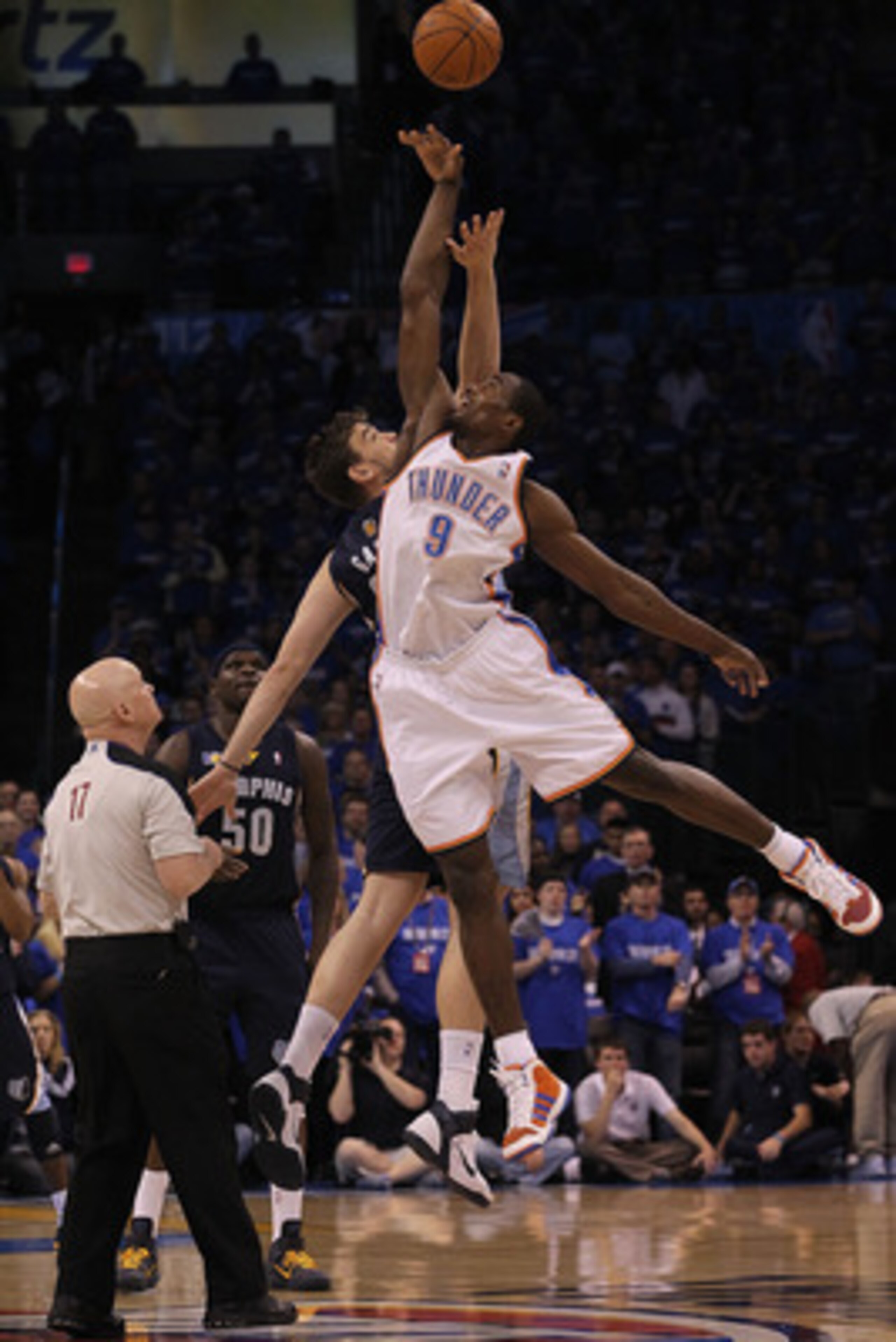OKLAHOMA CITY, OK - MAY 01:  Marc Gasol #33 of the Memphis Grizzlies and Serge Ibaka #9 of the Oklahoma City Thunder tip off in Game One of the Western Conference Semifinals in the 2011 NBA Playoffs on May 1, 2011 at Oklahoma City Arena in Oklahoma City, 