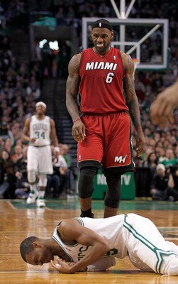 BOSTON - FEBRUARY 13:  LeBron James #6 of the Miami Heat looks at  Rajon Rondo #9 of the Boston Celtics after Rondo fell to the floor at TD Garden on February 13, 2011 in Boston, Massachusetts. NOTE TO USER: User expressly acknowledges and agrees that, by