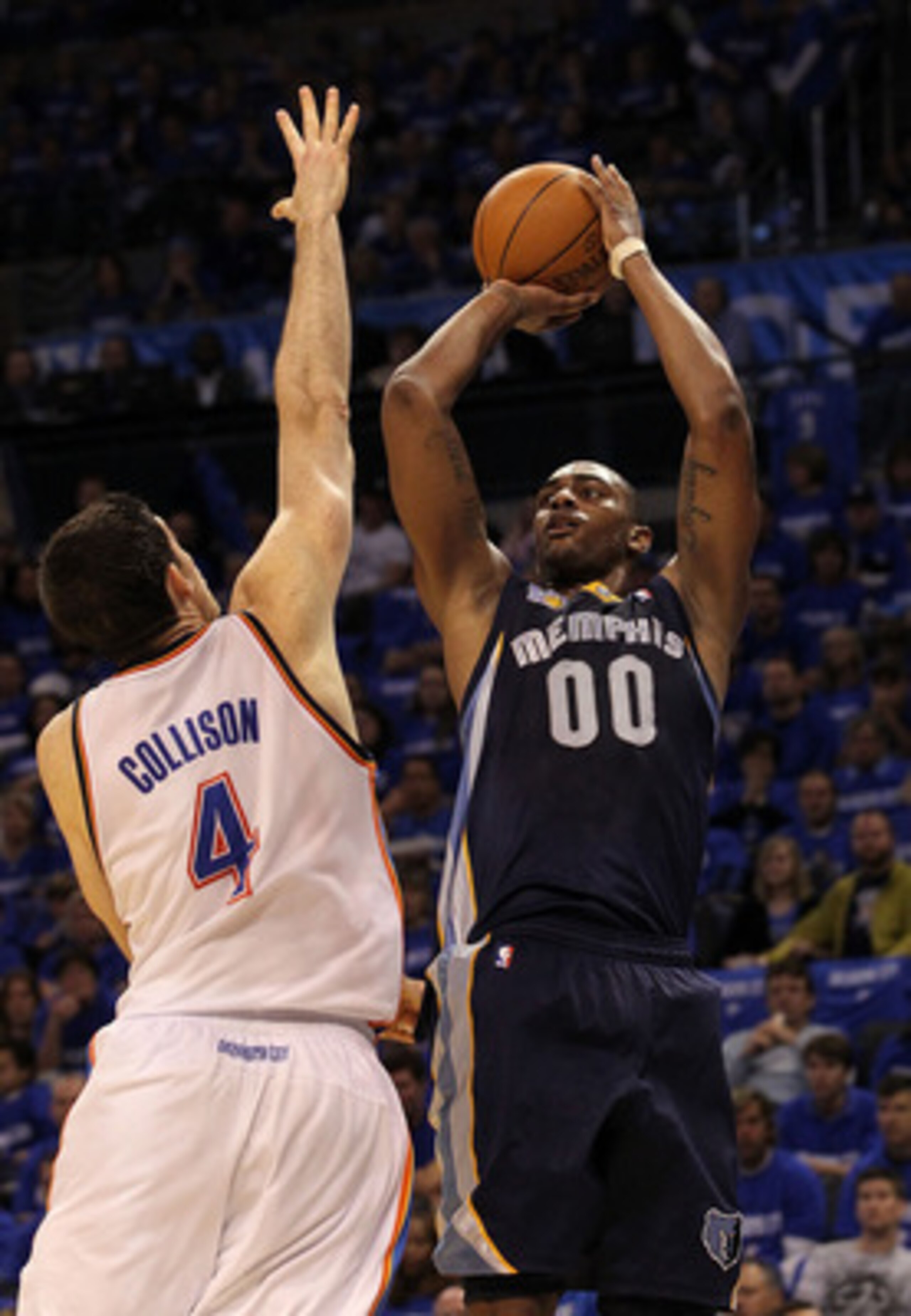 OKLAHOMA CITY, OK - MAY 01:  Forward Darrell Arthur #00 of the Memphis Grizzlies takes a shot against Nick Collison #4 of the Oklahoma City Thunder in Game One of the Western Conference Semifinals in the 2011 NBA Playoffs on May 1, 2011 at Oklahoma City A