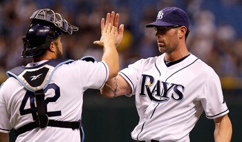 ST. PETERSBURG, FL - APRIL 15:  Pitcher Kyle Farnsworth #43 of the Tampa Bay Rays celebrates the last out with catcher Kelly Shoppach #10 during a game against the Minnesota Twins at Tropicana Field on April 15, 2011 in St. Petersburg, Florida.  (Photo by