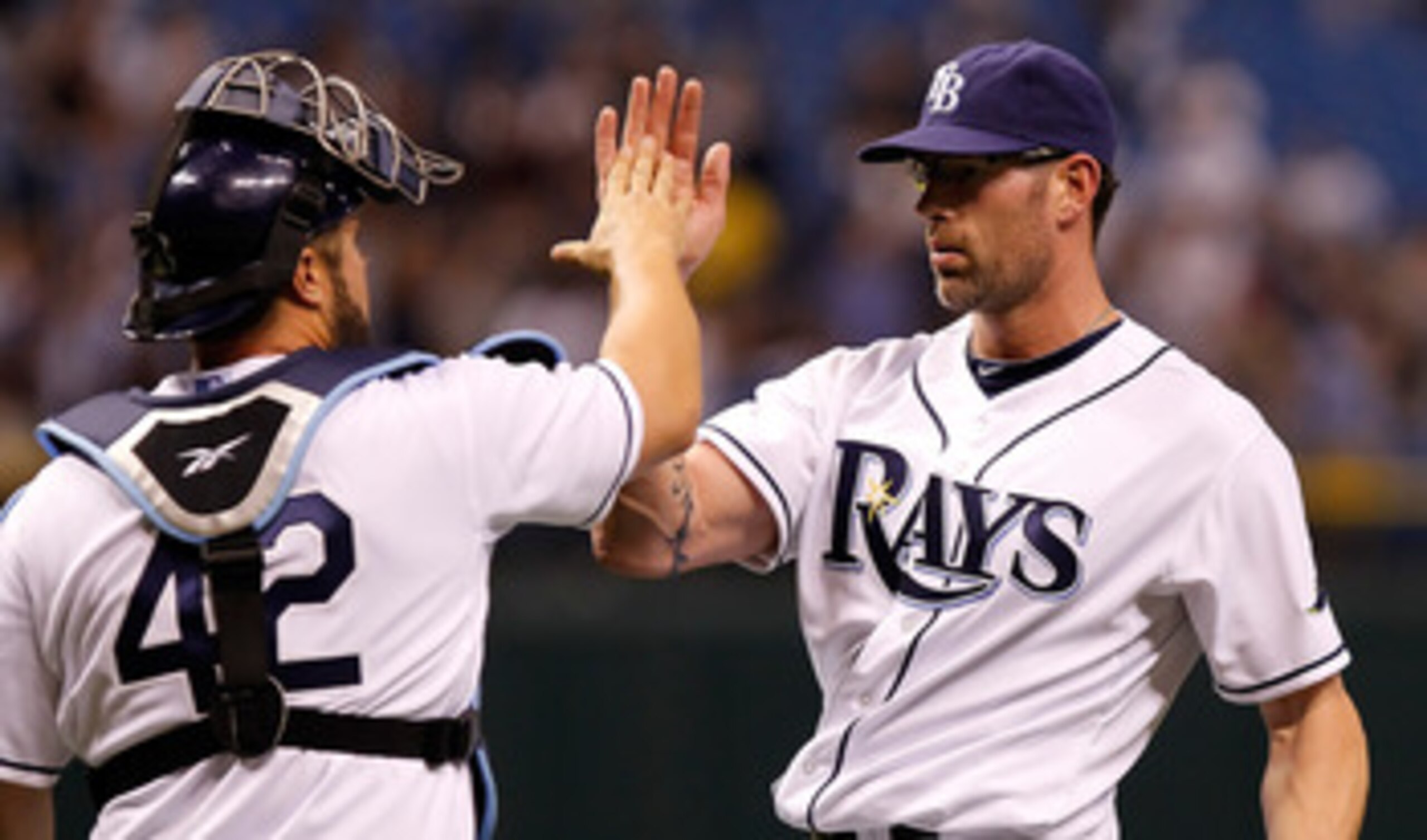 ST. PETERSBURG, FL - APRIL 15:  Pitcher Kyle Farnsworth #43 of the Tampa Bay Rays celebrates the last out with catcher Kelly Shoppach #10 during a game against the Minnesota Twins at Tropicana Field on April 15, 2011 in St. Petersburg, Florida.  (Photo by