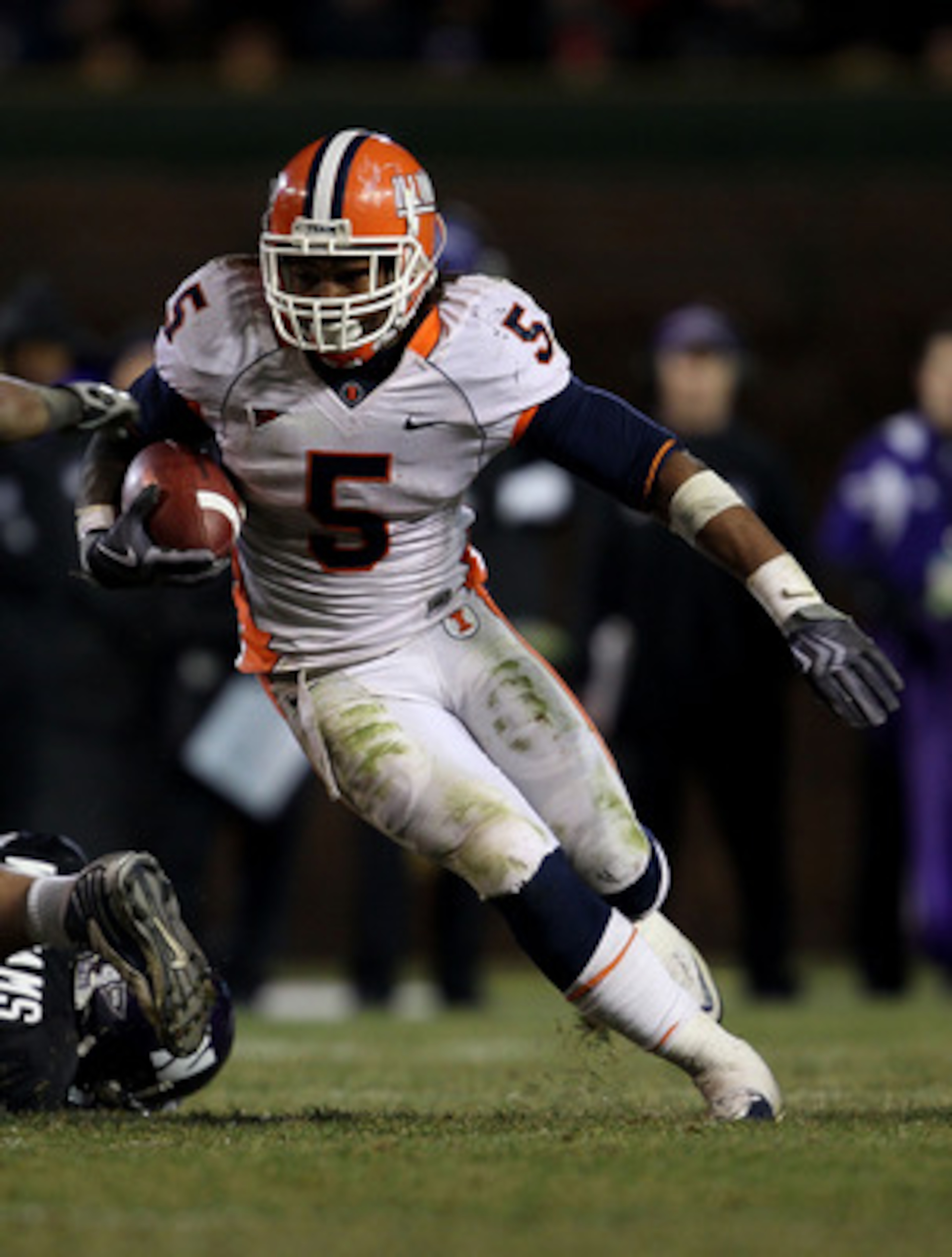 CHICAGO - NOVEMBER 20: Mikel Leshoure #5 of the Illinois Fighting Illini runs on his way to a 339 yard rushing performance against the Northwestern Wildcats during a game played at Wrigley Field on November 20, 2010 in Chicago, Illinois. Illinois defeated