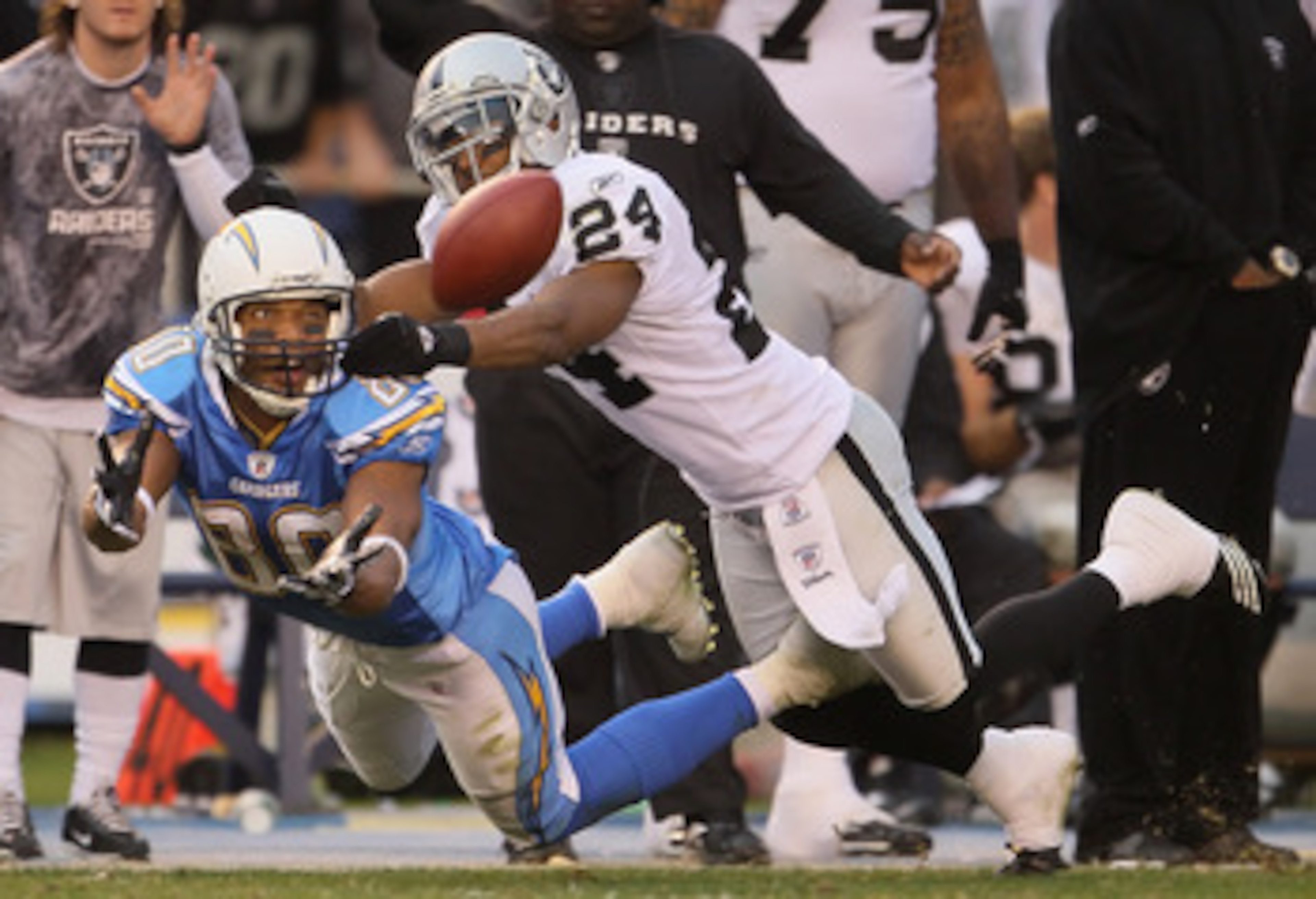 SAN DIEGO - DECEMBER 05: Michael Huff #24 of the Oakland Raiders breaks up a pass intended for wide receiver Malcolm Floyd #80 of the San Diego Chargers at Qualcomm Stadium on December 5, 2010 in San Diego, California. The Raiders defeated the Chargers 2 SAN DIEGO - DECEMBER 05: Michael Huff #24 of the Oakland Raiders breaks up a pass intended for wide receiver Malcolm Floyd #80 of the San Diego Chargers at Qualcomm Stadium on December 5, 2010 in San Diego, California. The Raiders defeated the Chargers 2