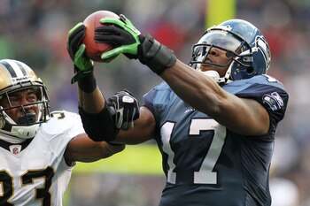 SEATTLE, WA - JANUARY 08:  Mike Williams #17 of the Seattle Seahawks completes a reception over Jabari Greer #33 of the New Orleans Saints during the 2011 NFC wild-card playoff game at Qwest Field on January 8, 2011 in Seattle, Washington.  (Photo by Jona