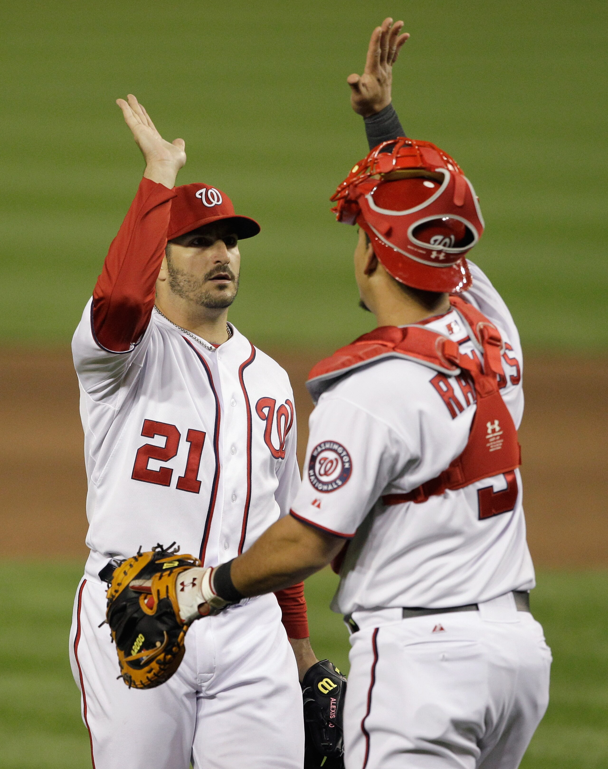 WASHINGTON, DC - APRIL 29: Starting pitcher Jason Marquis #21 and catcher Wilson Ramos #3 of the Washington Nationals celebrate the final out after defeating the San Francisco Giants 3-0 at Nationals Park on April 29, 2011 in Washington, DC.  (Photo by Ro