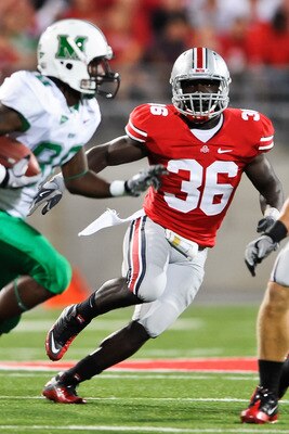 COLUMBUS, OH - SEPTEMBER 2: Brian Rolle #36 of the Ohio State Buckeyes pursues ballcarrier Courtney Edmonson #80 of the Marshall Thundering Herd at Ohio Stadium on September 2, 2010 in Columbus, Ohio. (Photo by Jamie Sabau/Getty Images)