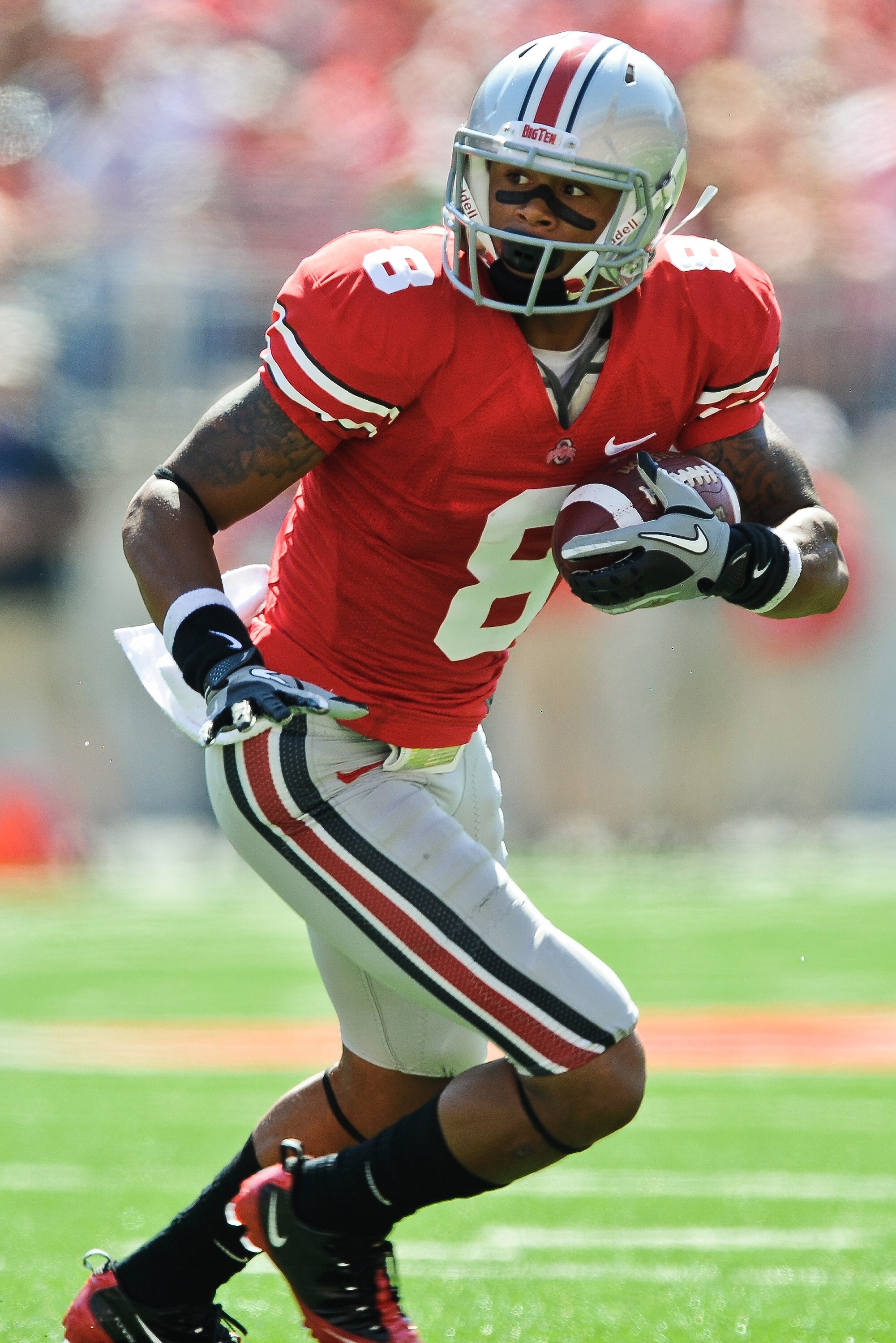 COLUMBUS, OH - SEPTEMBER 18:  DeVier Posey #8 of the Ohio State Buckeyes runs with the ball against the Ohio Bobcats at Ohio Stadium on September 18, 2010 in Columbus, Ohio.  (Photo by Jamie Sabau/Getty Images)