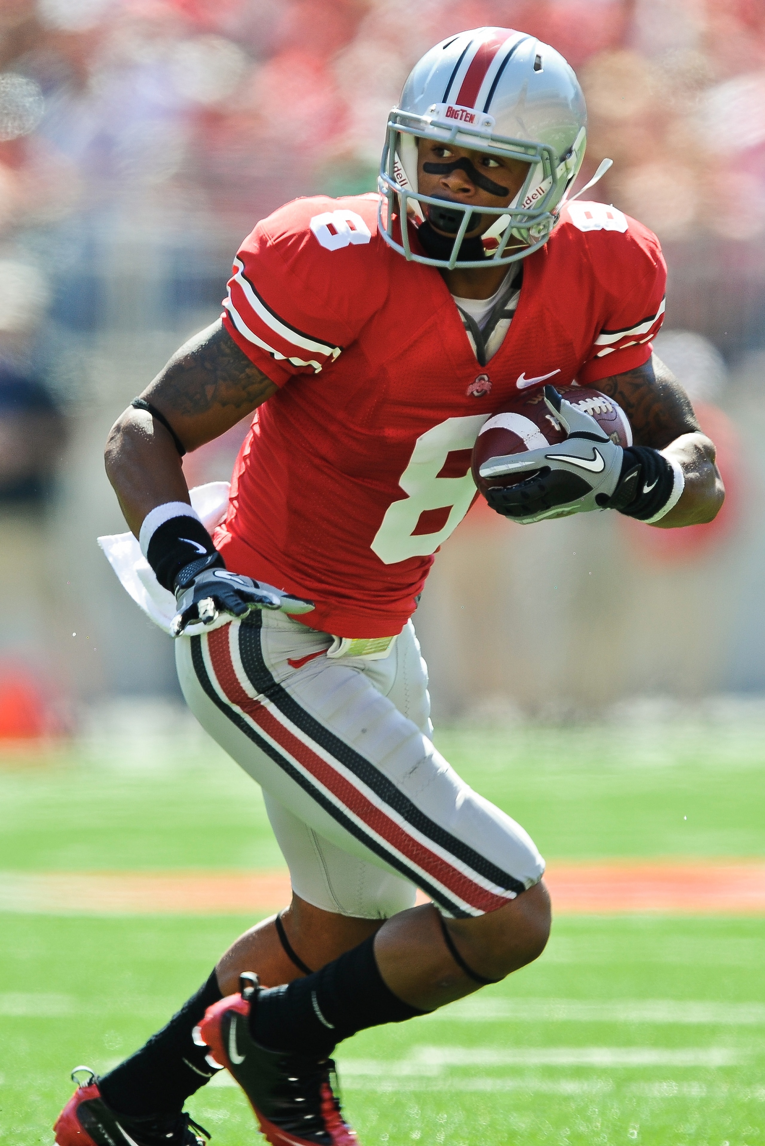 COLUMBUS, OH - SEPTEMBER 18:  DeVier Posey #8 of the Ohio State Buckeyes runs with the ball against the Ohio Bobcats at Ohio Stadium on September 18, 2010 in Columbus, Ohio.  (Photo by Jamie Sabau/Getty Images)