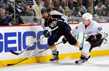 NASHVILLE, TN - APRIL 20:  Shea Weber #6 of the Nashville Predators dumps the puck in past Toni Lydman #32 of the Anaheim Ducks in Game Four of the Western Conference Quarterfinals during the 2011 NHL Stanley Cup Playoffs at Bridgestone Arena on April 20,