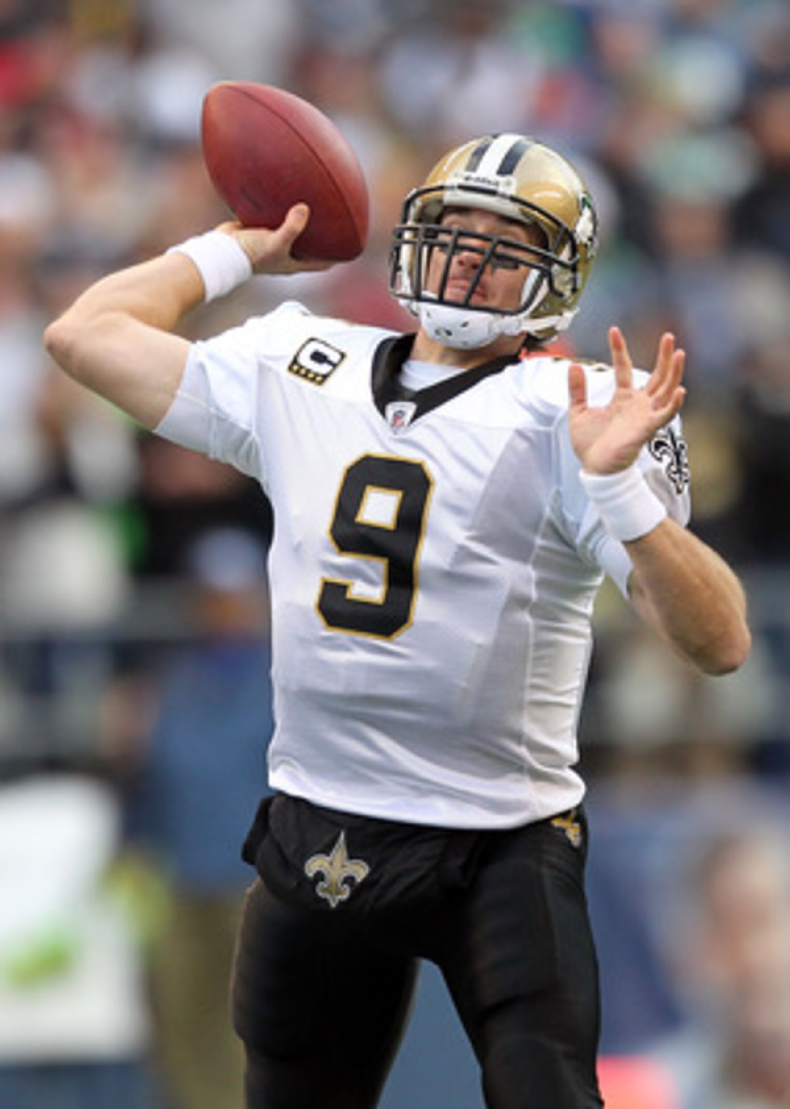 SEATTLE, WA - JANUARY 08:  Quarterback Drew Brees #9 of the New Orleans Saints throws the ball in the second quarter against the Seattle Seahawks during the 2011 NFC wild-card playoff game at Qwest Field on January 8, 2011 in Seattle, Washington.  (Photo