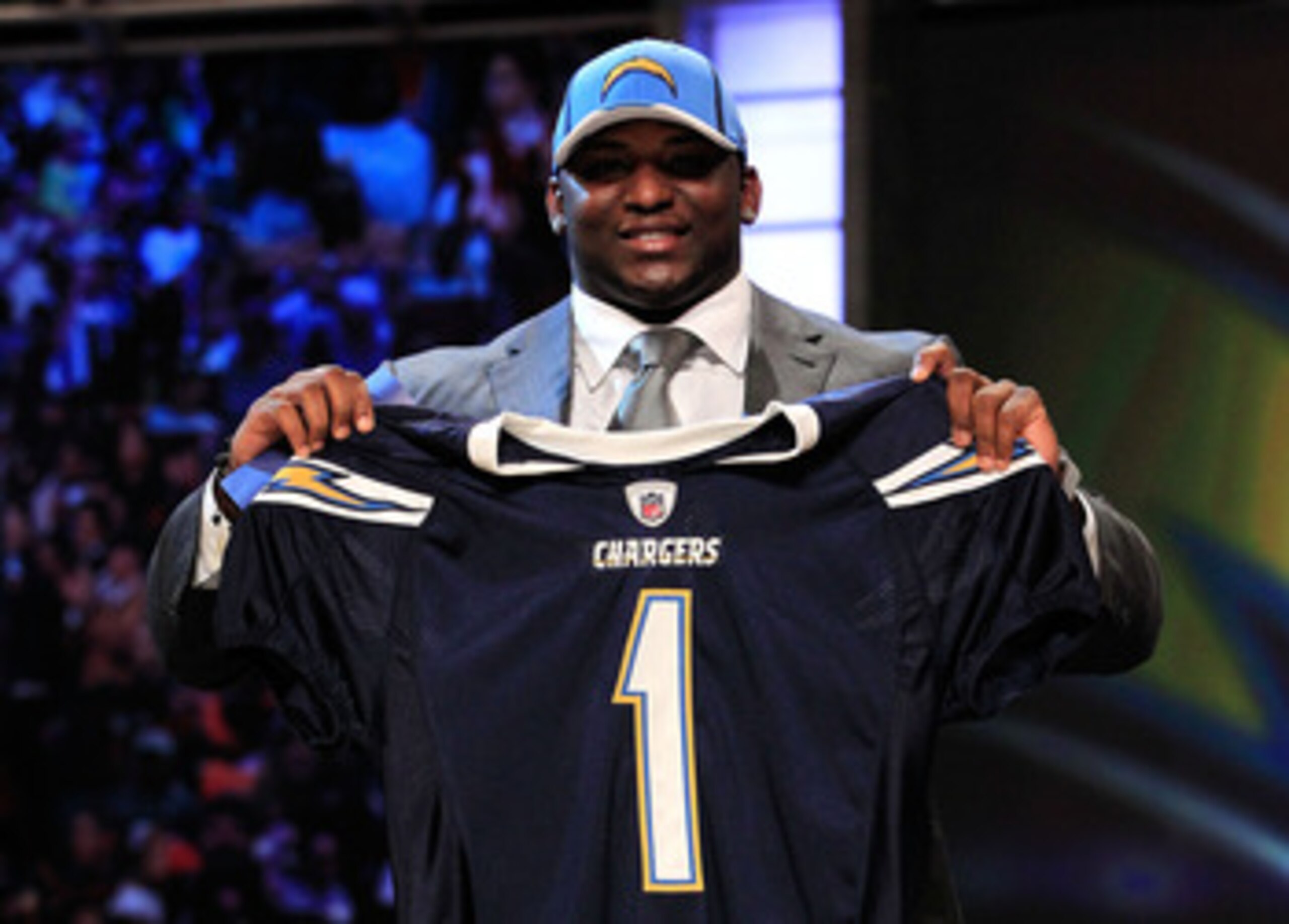 NEW YORK, NY - APRIL 28: Corey Liuget, #18 overall pick by the San Diego Chargers, holds up a jersey on stage during the 2011 NFL Draft at Radio City Music Hall on April 28, 2011 in New York City. (Photo by Chris Trotman/Getty Images) NEW YORK, NY - APRIL 28: Corey Liuget, #18 overall pick by the San Diego Chargers, holds up a jersey on stage during the 2011 NFL Draft at Radio City Music Hall on April 28, 2011 in New York City. (Photo by Chris Trotman/Getty Images)