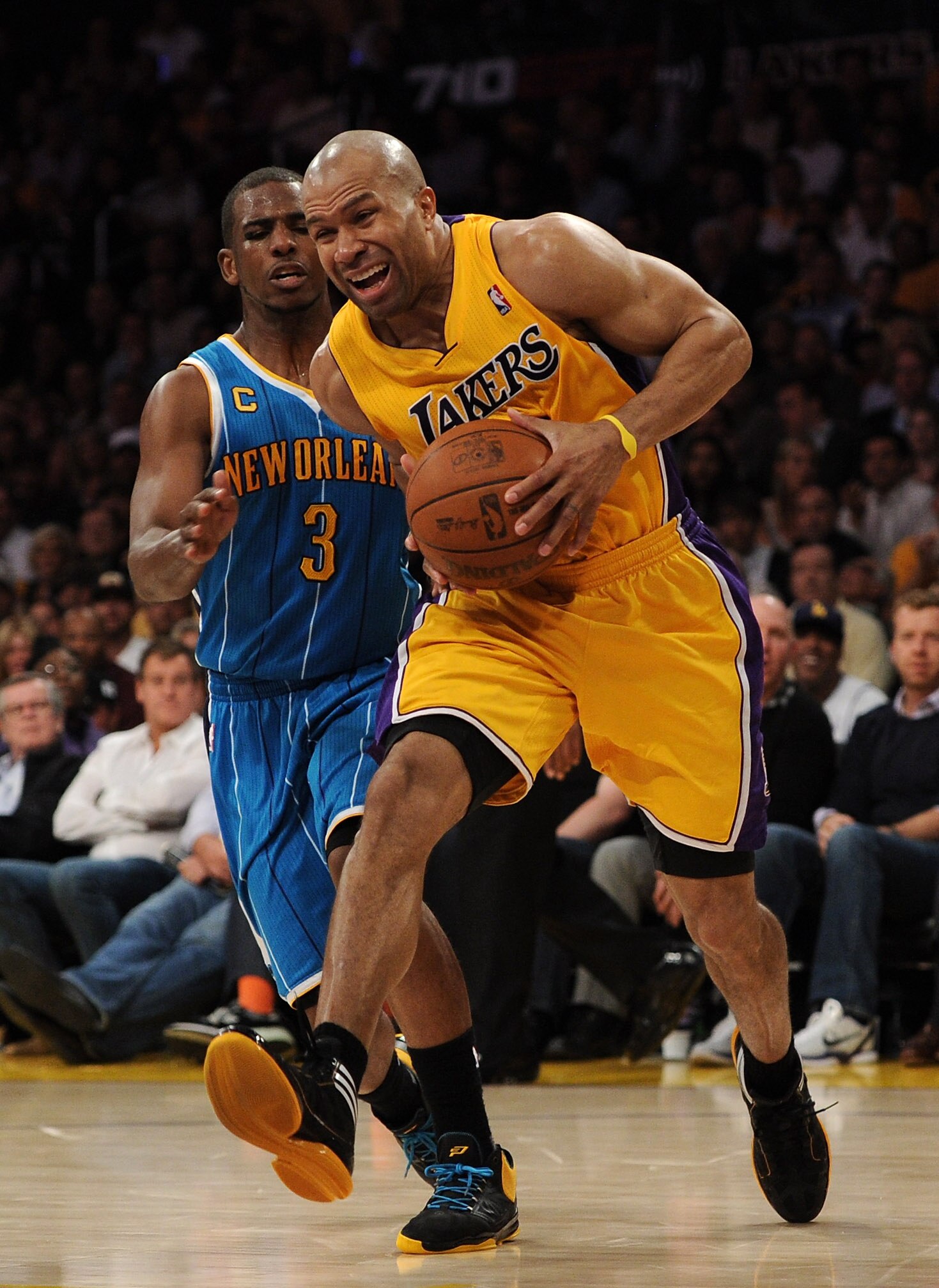 LOS ANGELES, CA - APRIL 26:  Derek Fisher #2 of the Los Angeles Lakers drives on Chris Paul #3 of the New Orleans Hornets in the second quarter in Game Five of the Western Conference Quarterfinals in the 2011 NBA Playoffs on April 26, 2011 at Staples Cent