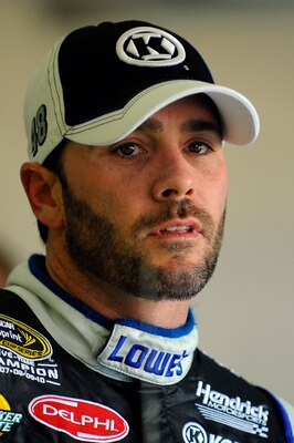FORT WORTH, TX - APRIL 07:  Jimmie Johnson, driver of the #48 Lowe's/Kobalt Tools Chevrolet, stands in the garage area during practice for the NASCAR Sprint Cup Series Samsung Mobile 500 at Texas Motor Speedway on April 7, 2011 in Fort Worth, Texas.  (Pho