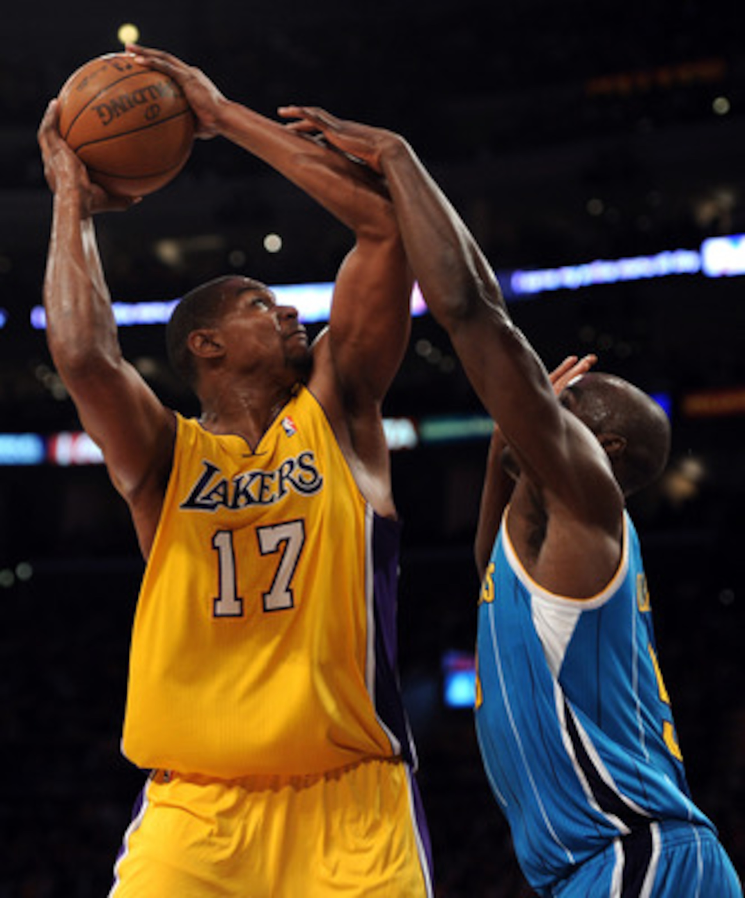 LOS ANGELES, CA - APRIL 26:  Andrew Bynum #17 of the Los Angeles Lakers looks to shoot over Emeka Okafor #50 of the New Orleans Hornets in the first quarter in Game Five of the Western Conference Quarterfinals in the 2011 NBA Playoffs on April 26, 2011 at