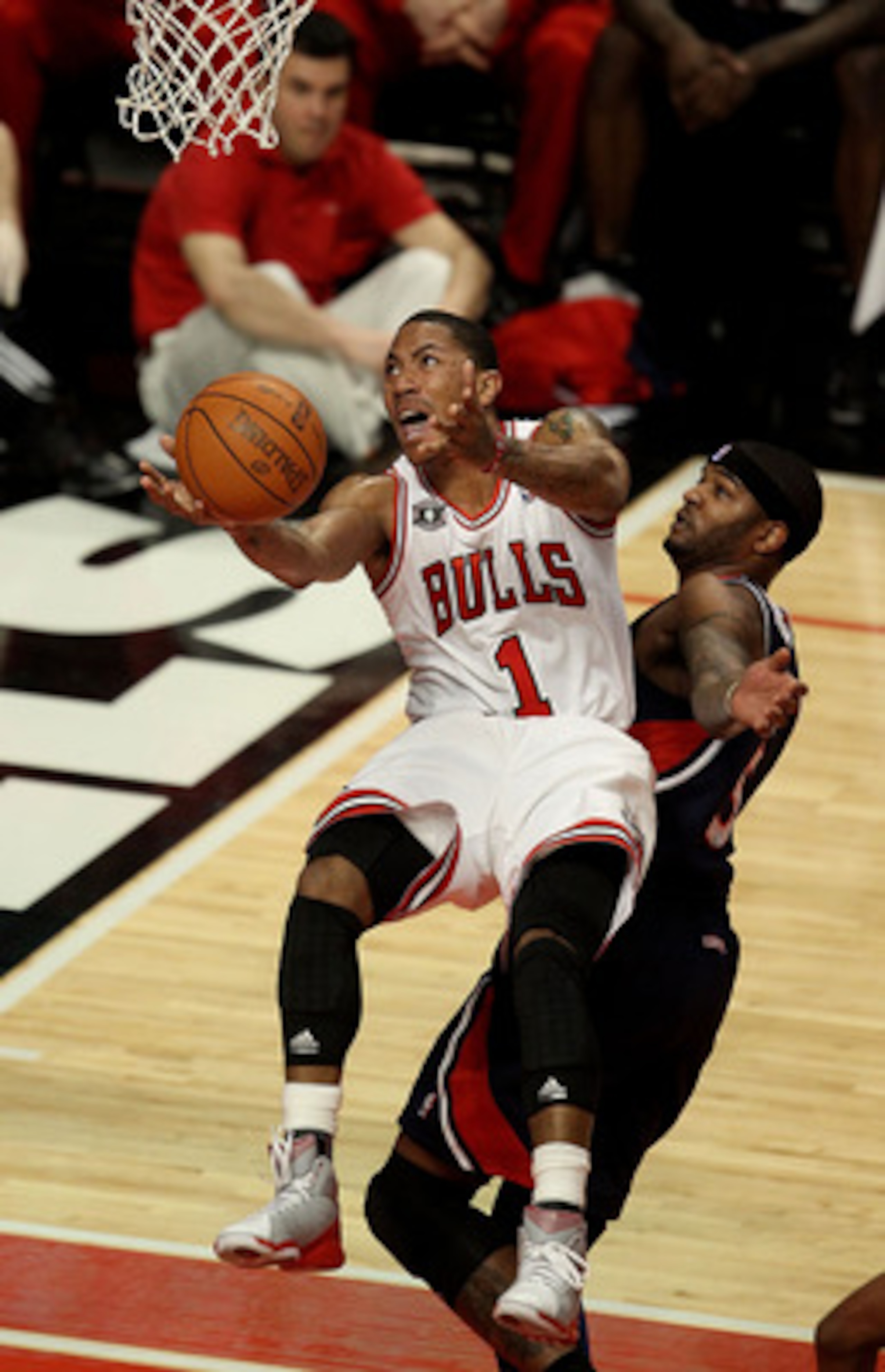 CHICAGO, IL - MARCH 11: Derrick Rose #1 of the Chicago Bulls puts up a shot against Josh Smith #5 of the Atlanta Hawks on his way to a game-high 34 points at the United Center on March 11, 2011 in Chicago, Illinois. The Bulls defeated the Hawks 94-76. NOT CHICAGO, IL - MARCH 11: Derrick Rose #1 of the Chicago Bulls puts up a shot against Josh Smith #5 of the Atlanta Hawks on his way to a game-high 34 points at the United Center on March 11, 2011 in Chicago, Illinois. The Bulls defeated the Hawks 94-76. NOT