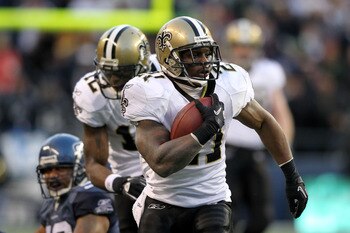 SEATTLE, WA - JANUARY 08:  Julius Jones #21 of the New Orleans Saints runs down field against the Seattle Seahawks during the 2011 NFC wild-card playoff game at Qwest Field on January 8, 2011 in Seattle, Washington.  (Photo by Jonathan Ferrey/Getty Images