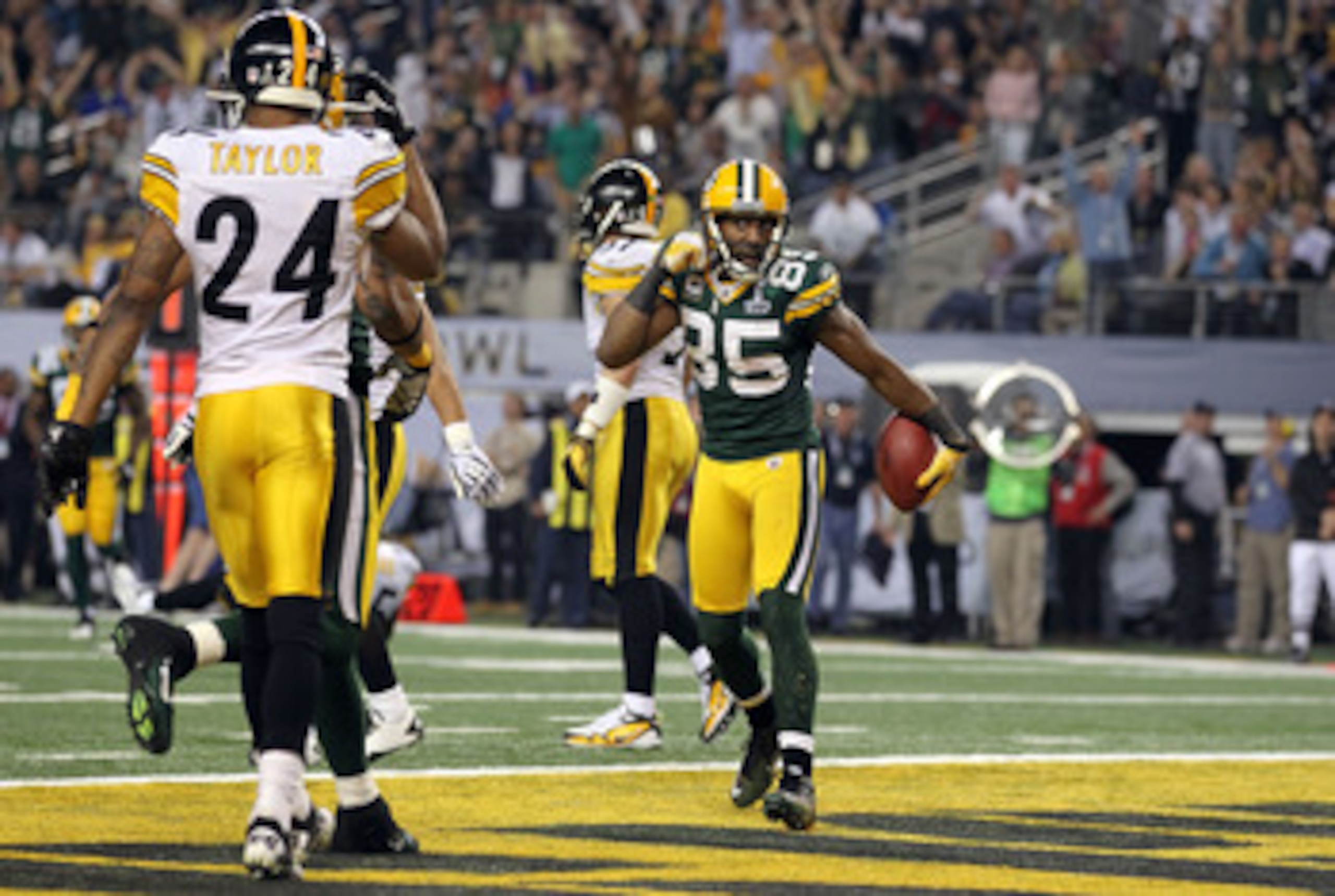 ARLINGTON, TX - FEBRUARY 06:  Greg Jennings #85 of the Green Bay Packers reacts after catching a 21 yard pass for a touchdown against the Pittsburgh Steelers during Super Bowl XLV at Cowboys Stadium on February 6, 2011 in Arlington, Texas. The Packers won
