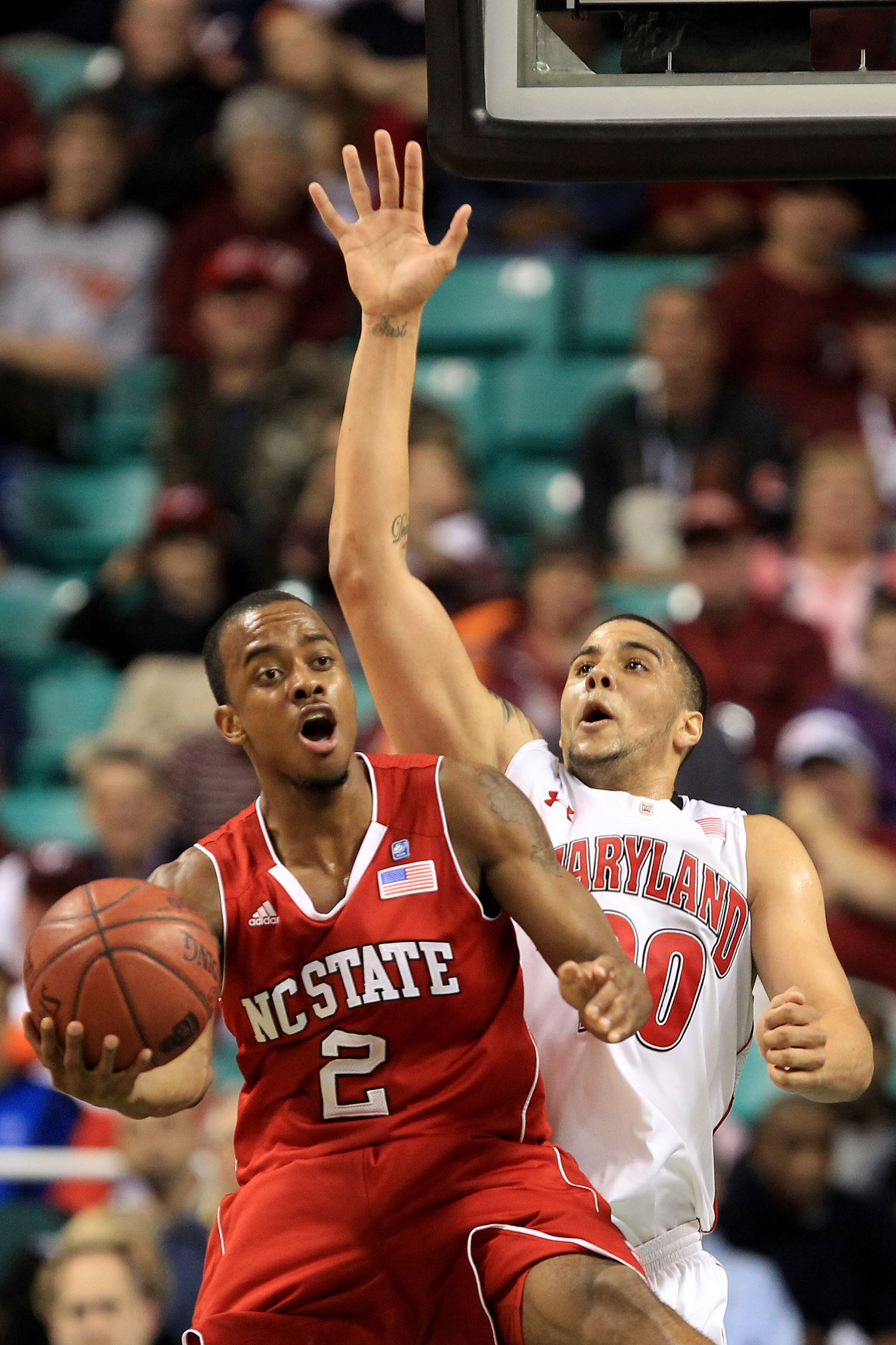 GREENSBORO, NC - MARCH 10:  Lorenzo Brown #2 of the North Carolina State Wolfpack reacts as he is blocked by Jordan Williams #20 of the Maryland Terrapins during the first round of the 2011 ACC men's basketball tournament at the Greensboro Coliseum on Mar