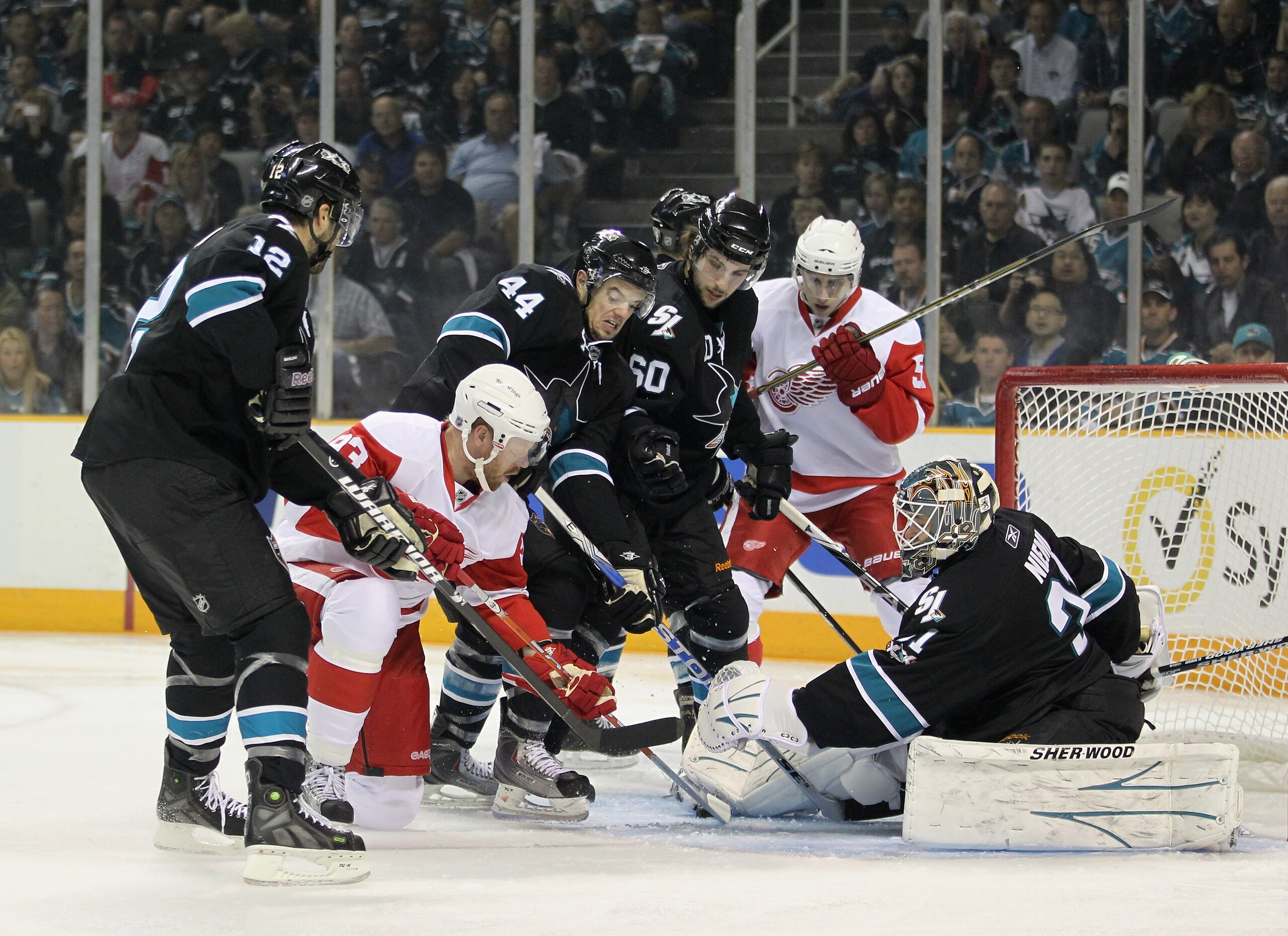 SAN JOSE, CA - MAY 01:  Antti Niemi #31 of the San Jose Sharks and the San Jose defense stop Johan Franzen #93 of the Detroit Red Wings from scoring in Game Two of the Western Conference Semifinals during the 2011 NHL Stanley Cup Playoffs at HP Pavilion o