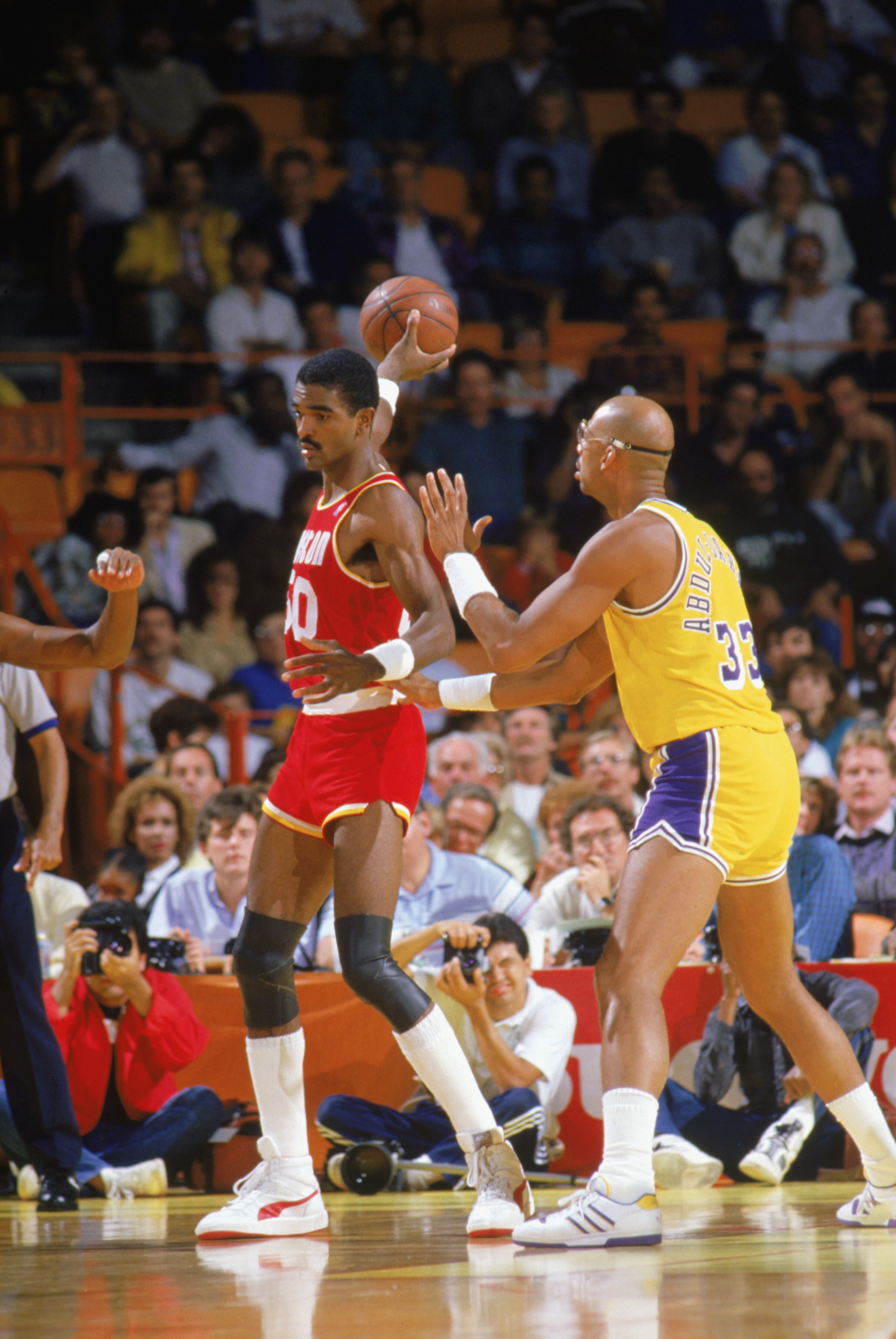 INGLEWOOD -1987:  Ralph Sampson #50 of the Houston Rockets guards the ball from Kareem Abdul-Jabbar #33 of the Los Angeles Lakers during a game in the1987-88 season at the Forum in Inglewood, Califronia.. NOTE TO USER: User expressly acknowledges and agre