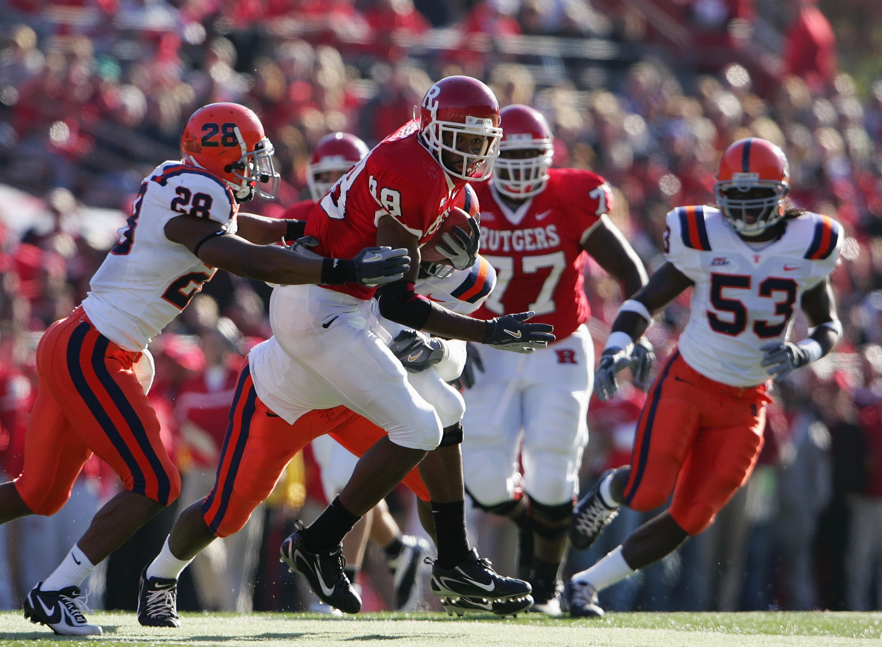 PISCATAWAY, NJ - NOVEMBER 25: Kenny Britt #88 of the Rutgers Scarlet Knights is grabbed by Tanard Jackson #28 of the Syracuse University Orange on November 25, 2006 at Rutgers Stadium in Piscataway, New Jersey. (Photo by Chris McGrath/Getty Images)