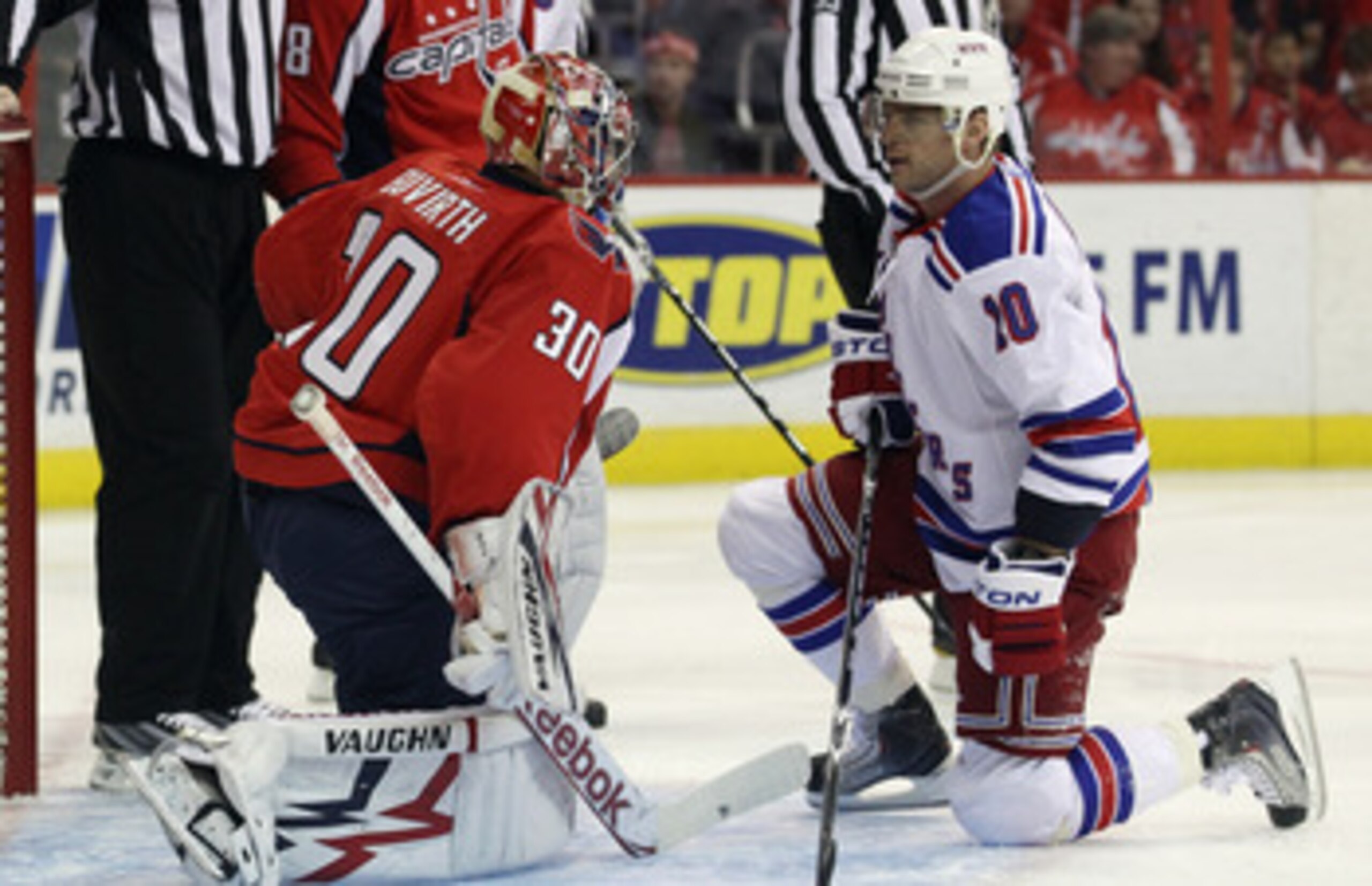 WASHINGTON, DC - APRIL 15: Michal Neuvirth #30 of the Washington Capitals and Marian Gaborik #10 of the New York Rangers exchange a few words during a play stoppage in the first period in Game Two of the Eastern Conference Quarterfinals during the 2011 NH
