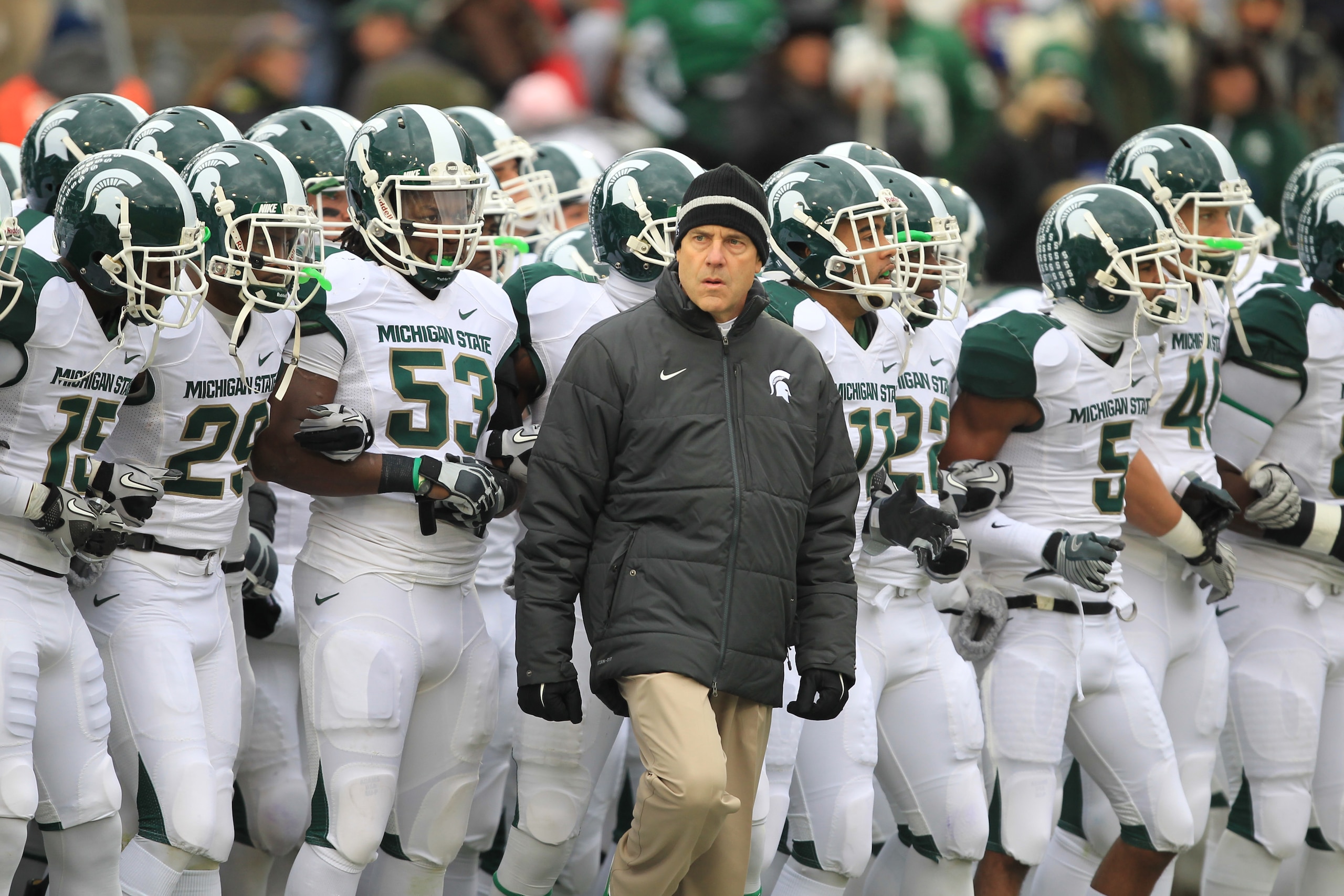 STATE COLLEGE, PA - NOVEMBER 27: Head coach Mark Dantonio of the Michigan State Spartans leads his team onto the field before a game against the Penn State Nittany Lions on November 27, 2010 at Beaver Stadium in State College, Pennsylvania. The Spartans w