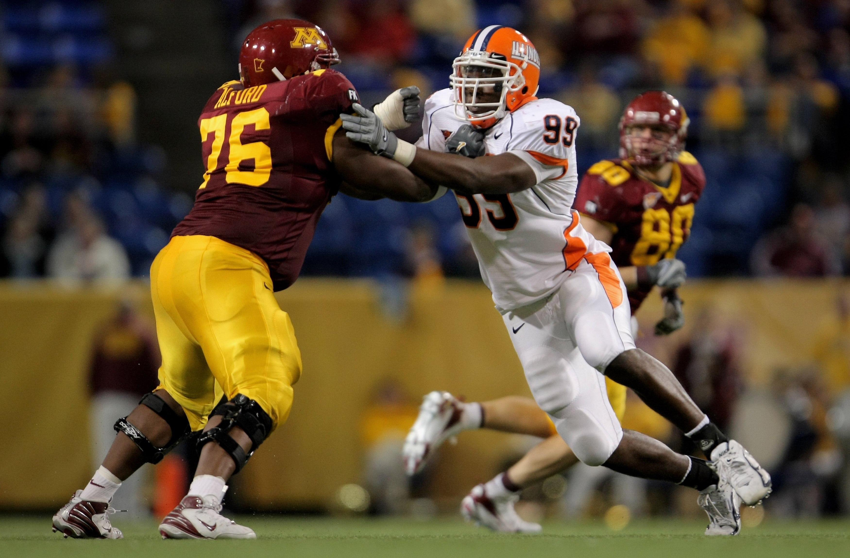 MINNEAPOLIS, MN - NOVEMBER 03:  Guard Dominic Alford #76 of the Minnesota Golden Gophers blocks defensive end Jerry Brown #99 of the Illinois Fighting Illini at the Hubert H. Humphrey Metrodome on November 3, 2007 in Minneapolis, Minnesota. Illinois defea