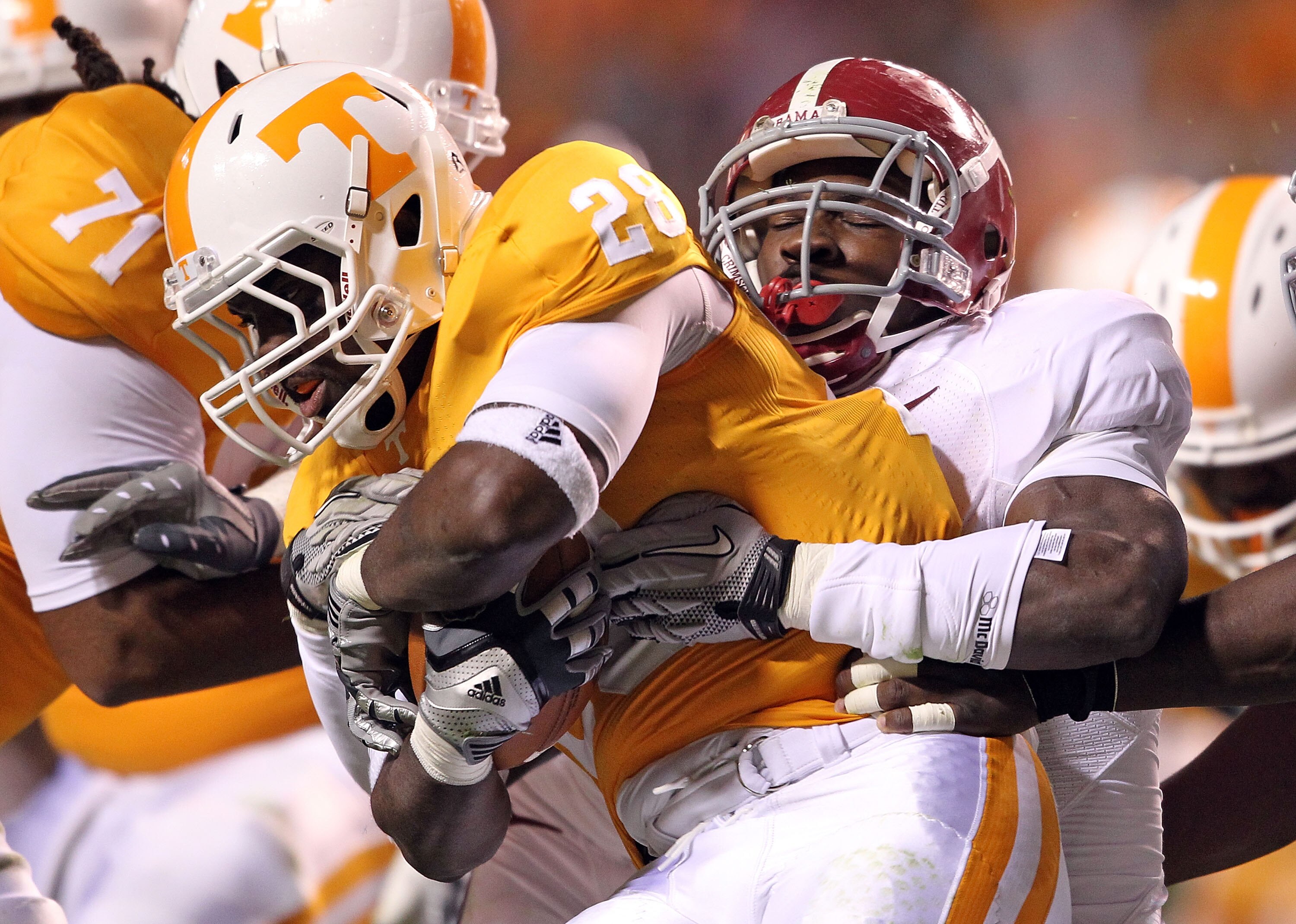 KNOXVILLE, TN - OCTOBER 23: Tauren Poole #28 of the Tennessee Volunteers runs with the ball dwhile tackled by C.J. Mosley #32 of the Alabama Crimson Tide at Neyland Stadium on October 23, 2010 in Knoxville, Tennessee. (Photo by Andy Lyons/Getty Images) KNOXVILLE, TN - OCTOBER 23: Tauren Poole #28 of the Tennessee Volunteers runs with the ball dwhile tackled by C.J. Mosley #32 of the Alabama Crimson Tide at Neyland Stadium on October 23, 2010 in Knoxville, Tennessee. (Photo by Andy Lyons/Getty Images)
