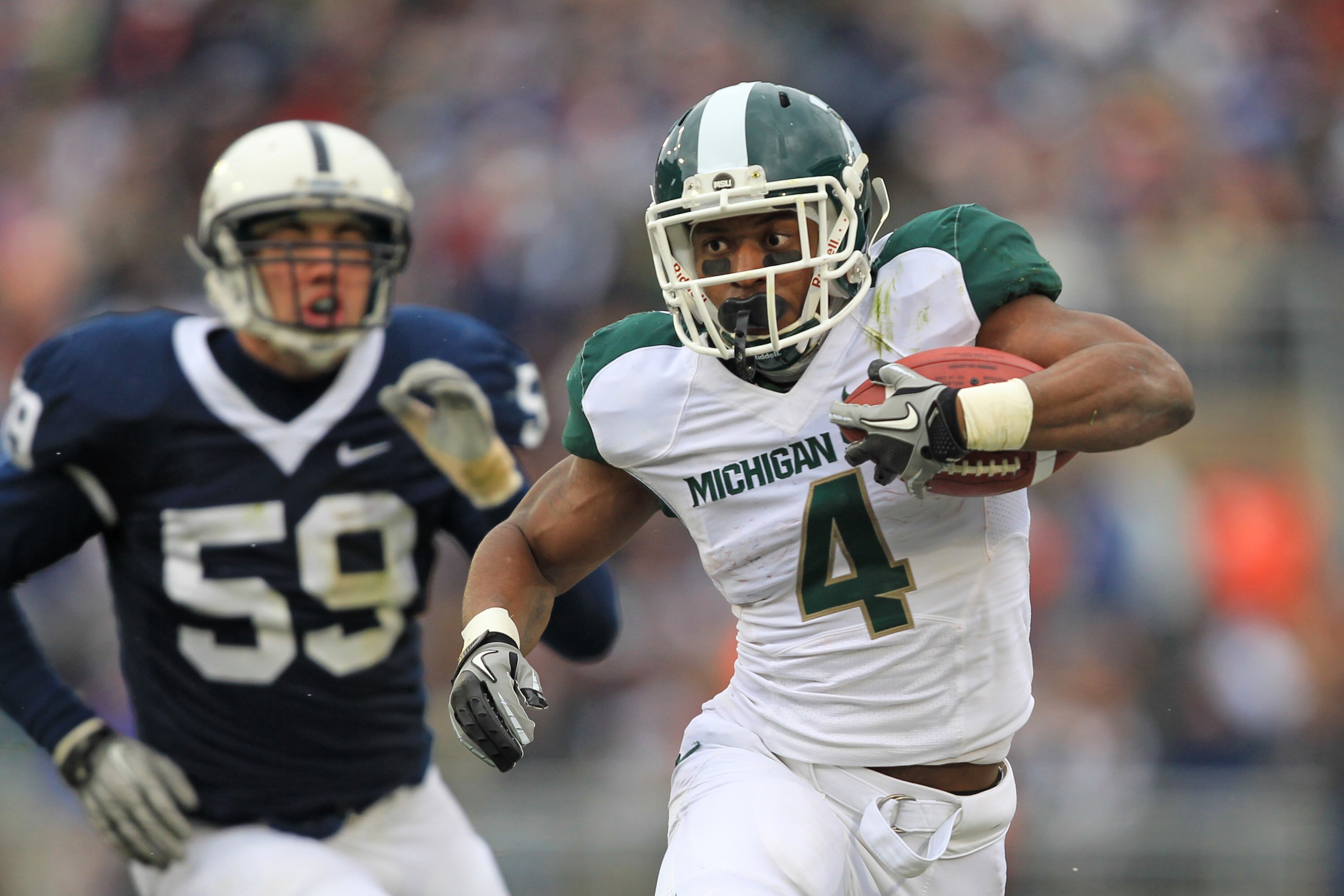 STATE COLLEGE, PA - NOVEMBER 27: Running back Edwin Baker #4 of the Michigan State Spartans carries the ball during a game against the Penn State Nittany Lions on November 27, 2010 at Beaver Stadium in State College, Pennsylvania. (Photo by Hunter Martin/ STATE COLLEGE, PA - NOVEMBER 27: Running back Edwin Baker #4 of the Michigan State Spartans carries the ball during a game against the Penn State Nittany Lions on November 27, 2010 at Beaver Stadium in State College, Pennsylvania. (Photo by Hunter Martin/