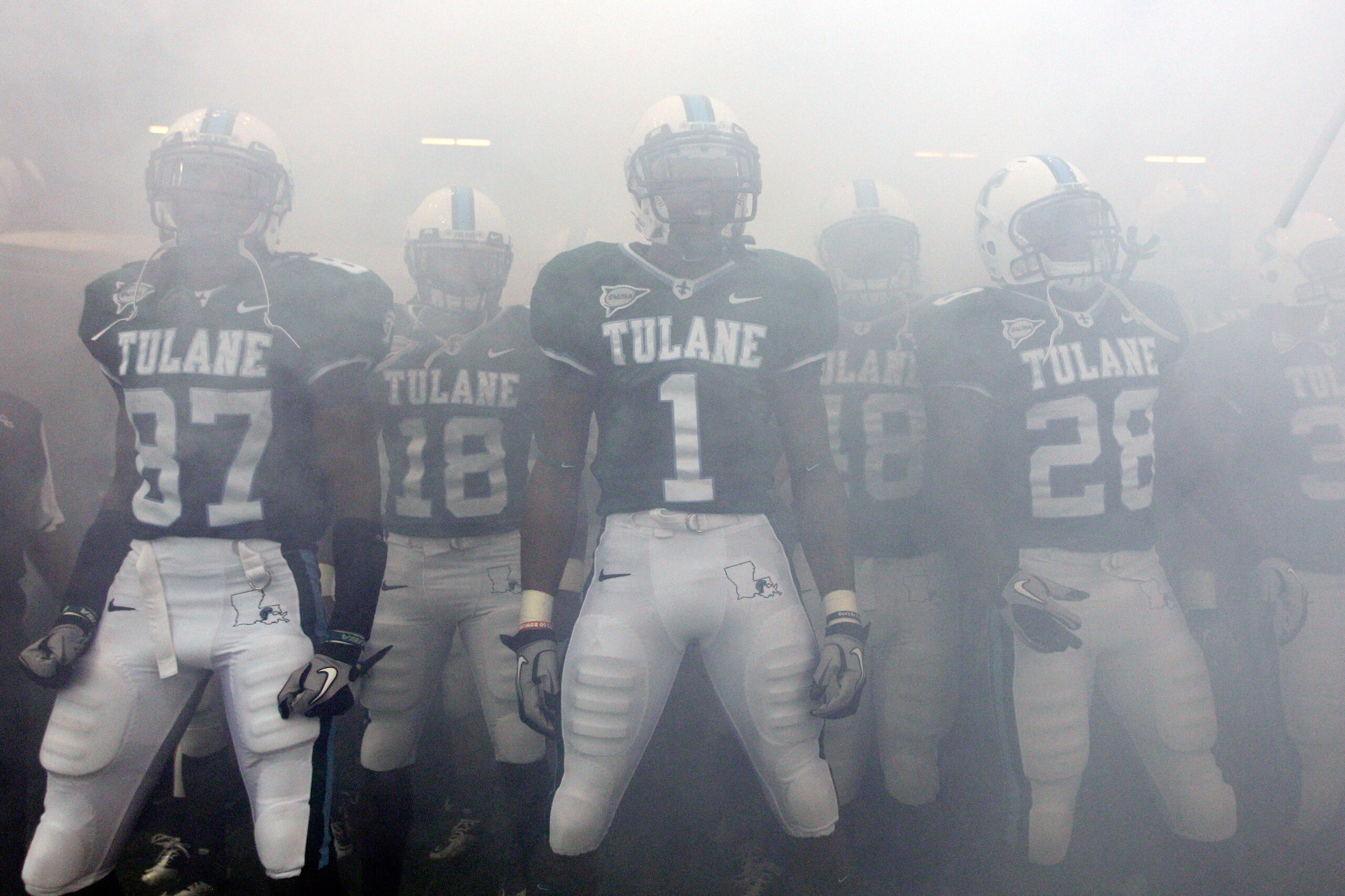 NEW ORLEANS - SEPTEMBER 11:  Members of the Tulane Green Wave take the field before playing the Ole Miss Rebels at the Louisiana Superdome on September 11, 2010 in New Orleans, Louisiana.  (Photo by Chris Graythen/Getty Images)