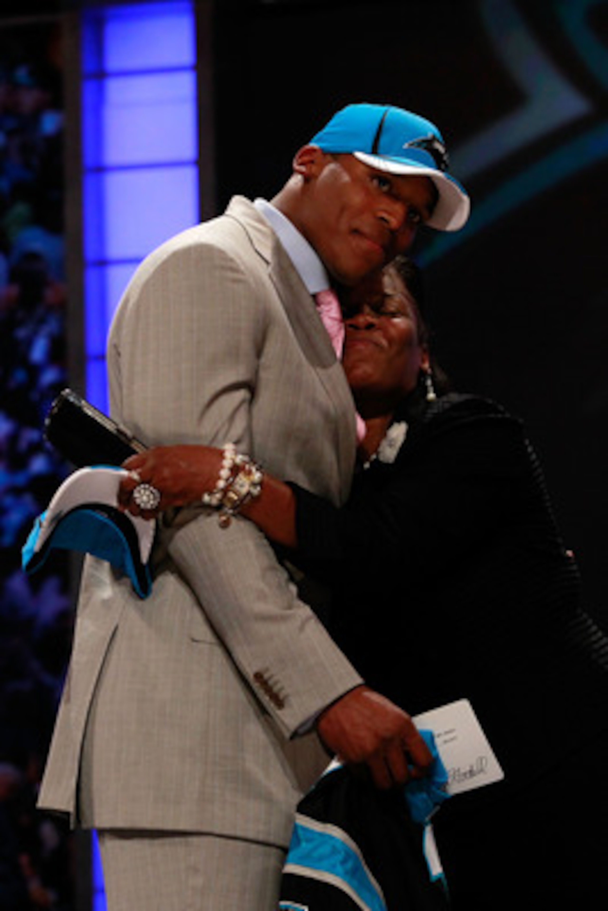 NEW YORK, NY - APRIL 28:  Cam Newton receives a hug from his mother Jackie on stage after he was selected #1 overall by the Carolina Panthers during the 2011 NFL Draft at Radio City Music Hall on April 28, 2011 in New York City.  (Photo by Chris Trotman/G