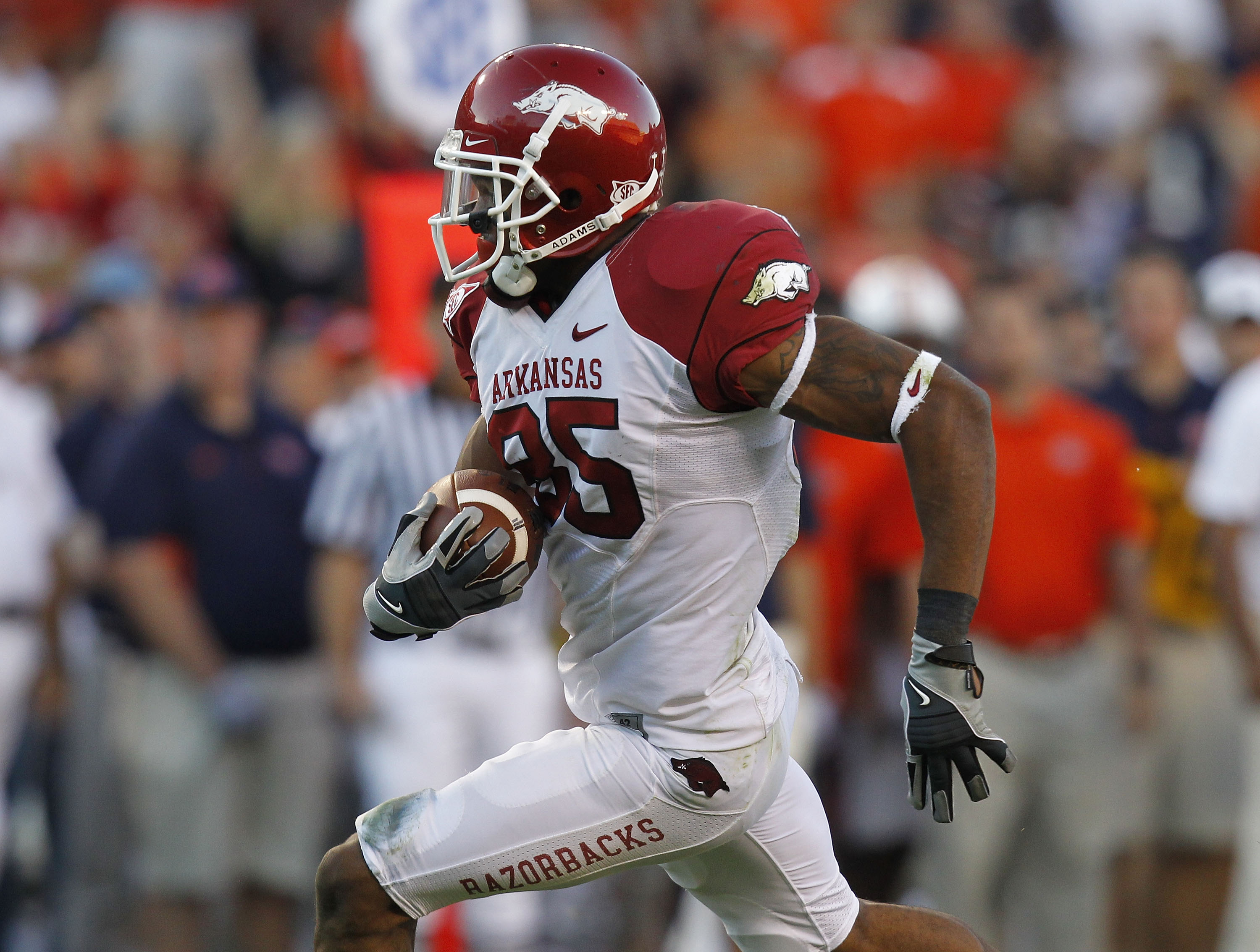 AUBURN - OCTOBER 16: Wide receiver Greg Childs #85 of the Arkansas Razorbacks makes a reception and runs for a touchdown in the fourth quarter during the game against the Auburn Tigers at Jordan-Hare Stadium on October 16, 2010 in Auburn, Alabama. The T AUBURN - OCTOBER 16: Wide receiver Greg Childs #85 of the Arkansas Razorbacks makes a reception and runs for a touchdown in the fourth quarter during the game against the Auburn Tigers at Jordan-Hare Stadium on October 16, 2010 in Auburn, Alabama. The T