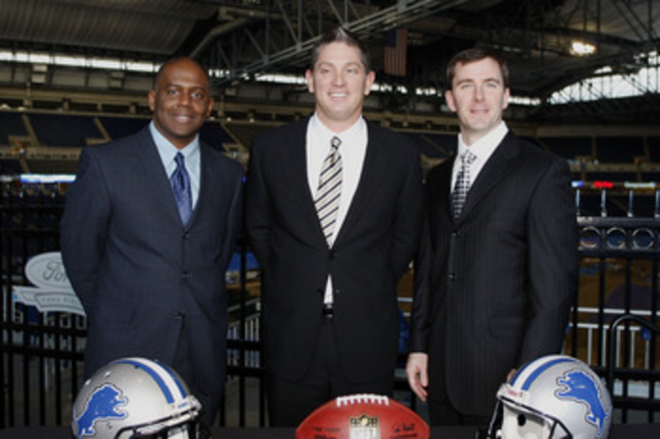 DETROIT , MI - JANUARY 16: Jim Schwartz, center, head coach of the Detroit Lions poses with General Manager Martin Mayhew, left, and Tom Lewand team president after a press conference to introduce him as the Lions new head coach on January 16, 2009 at Fo DETROIT , MI - JANUARY 16: Jim Schwartz, center, head coach of the Detroit Lions poses with General Manager Martin Mayhew, left, and Tom Lewand team president after a press conference to introduce him as the Lions new head coach on January 16, 2009 at Fo