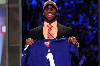NEW YORK, NY - APRIL 28:  Prince Amukamara, #19 overall pick by the New York Giants, holds up a jersey on stage during the 2011 NFL Draft at Radio City Music Hall on April 28, 2011 in New York City.  (Photo by Chris Trotman/Getty Images)
