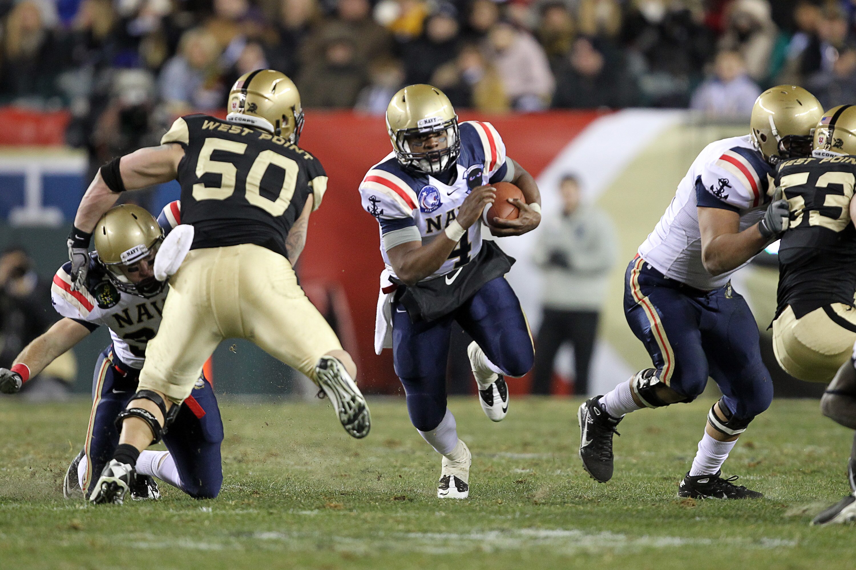 PHILADELPHIA - DECEMBER 11: Quarterback Ricky Dobbs #4 of the Navy Midshipmen carries the ball during the game against the Army Black Knights on December 11, 2010 at Lincoln Financial Field in Philadelphia, Pennsylvania. The Midshipmen won 31-17. (Photo b