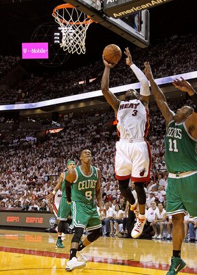 MIAMI, FL - MAY 01:  Dwyane Wade #3 of the Miami Heat shoots over Rajon Rondo #9 of the Boston Celtics during Game One of the Eastern Conference Semifinals of the 2011 NBA Playoffs at American Airlines Arena on May 1, 2011 in Miami, Florida. NOTE TO USER: