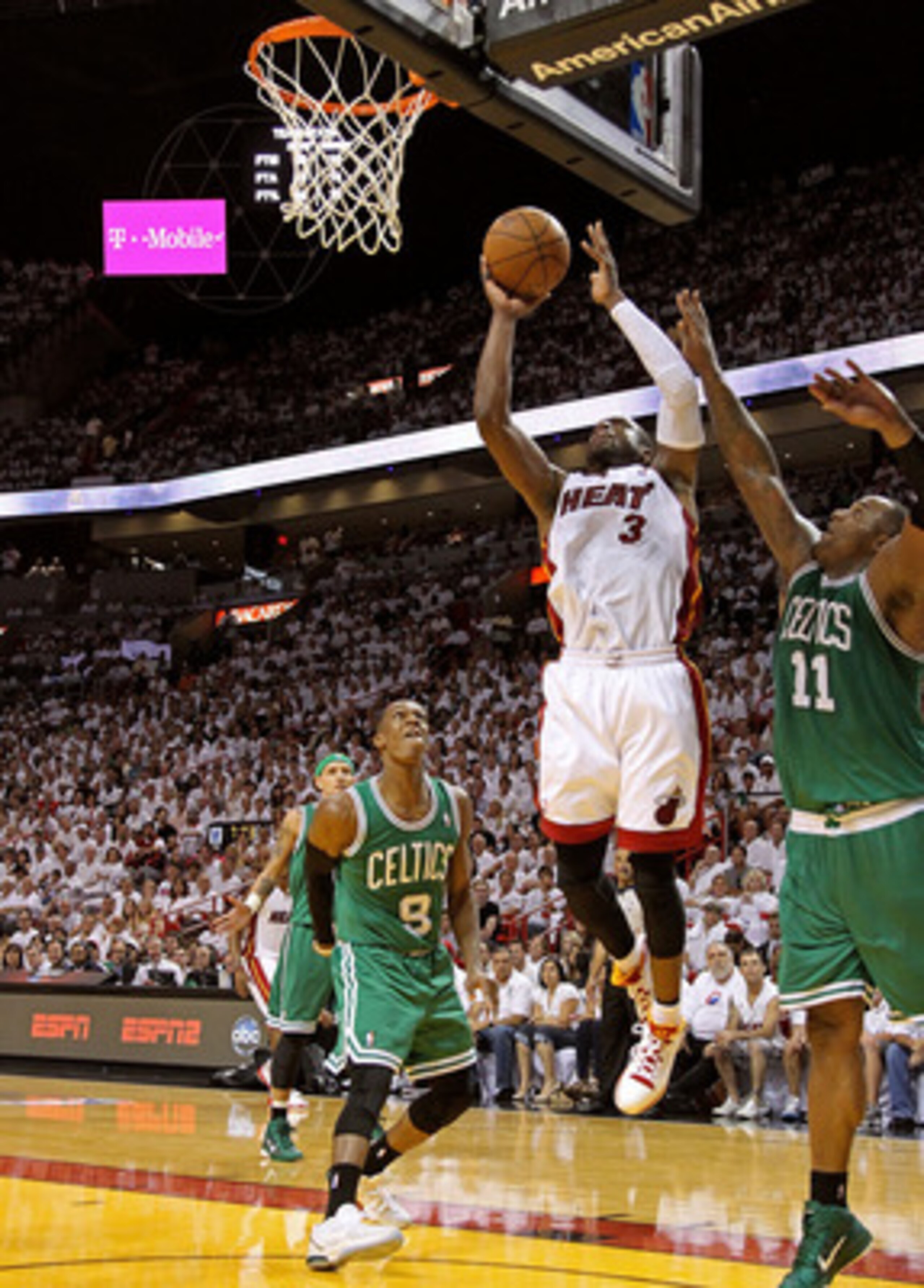 MIAMI, FL - MAY 01:  Dwyane Wade #3 of the Miami Heat shoots over Rajon Rondo #9 of the Boston Celtics during Game One of the Eastern Conference Semifinals of the 2011 NBA Playoffs at American Airlines Arena on May 1, 2011 in Miami, Florida. NOTE TO USER: