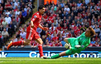 LIVERPOOL, ENGLAND - MAY 01:  Luis Suarez of Liverpool scores the third goal during the Barclays Premier League match between Liverpool  and Newcastle United at Anfield on May 1, 2011 in Liverpool, England.  (Photo by Clive Brunskill/Getty Images)