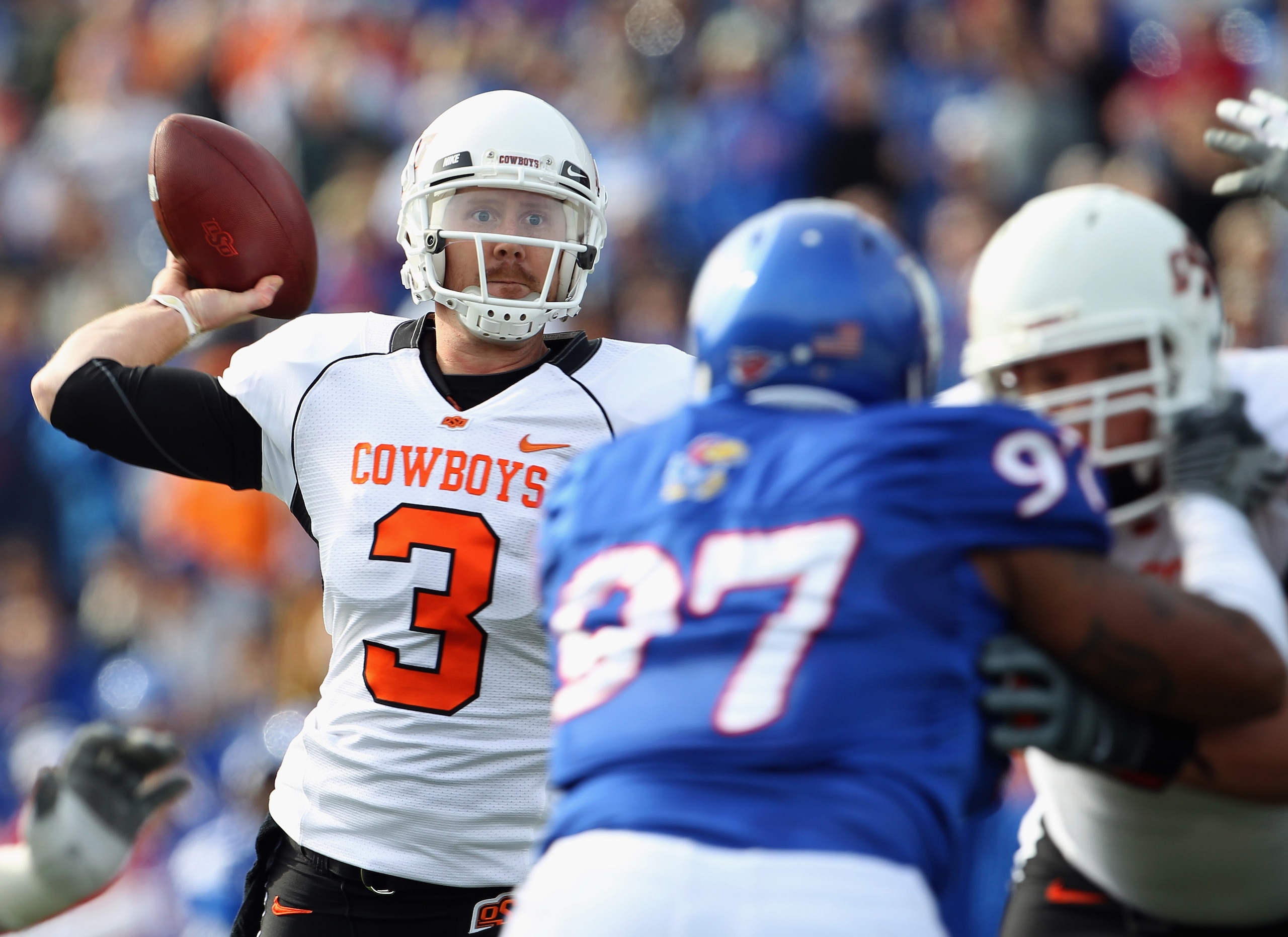 LAWRENCE, KS - NOVEMBER 20:  Quarterback Brandon Weeden #3 of the Oklahoma State Cowboys passes during the game against  the Kansas Jayhawks on November 20, 2010 at Memorial Stadium in Lawrence, Kansas.  (Photo by Jamie Squire/Getty Images)