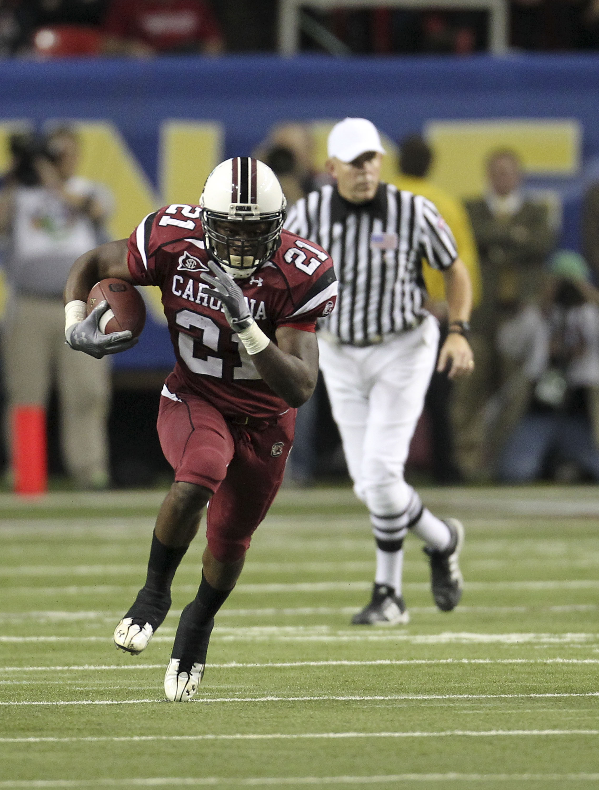 ATLANTA - DECEMBER 4: Running back Marcus Lattimore #21 of the South Carolina Gamecocks runs with the ball during the 2010 SEC Championship against the Auburn Tigers at Georgia Dome on December 4, 2010 in Atlanta, Georgia. (Photo by Mike Zarrilli/Getty I ATLANTA - DECEMBER 4: Running back Marcus Lattimore #21 of the South Carolina Gamecocks runs with the ball during the 2010 SEC Championship against the Auburn Tigers at Georgia Dome on December 4, 2010 in Atlanta, Georgia. (Photo by Mike Zarrilli/Getty I