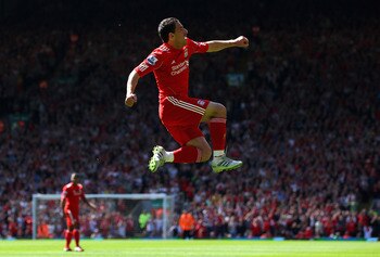 LIVERPOOL, ENGLAND - MAY 01:  Maxi Rodriguez of Liverpool leaps into the air to celebrate after scoring the first goal during the Barclays Premier League match between Liverpool  and Newcastle United at Anfield on May 1, 2011 in Liverpool, England.  (Phot