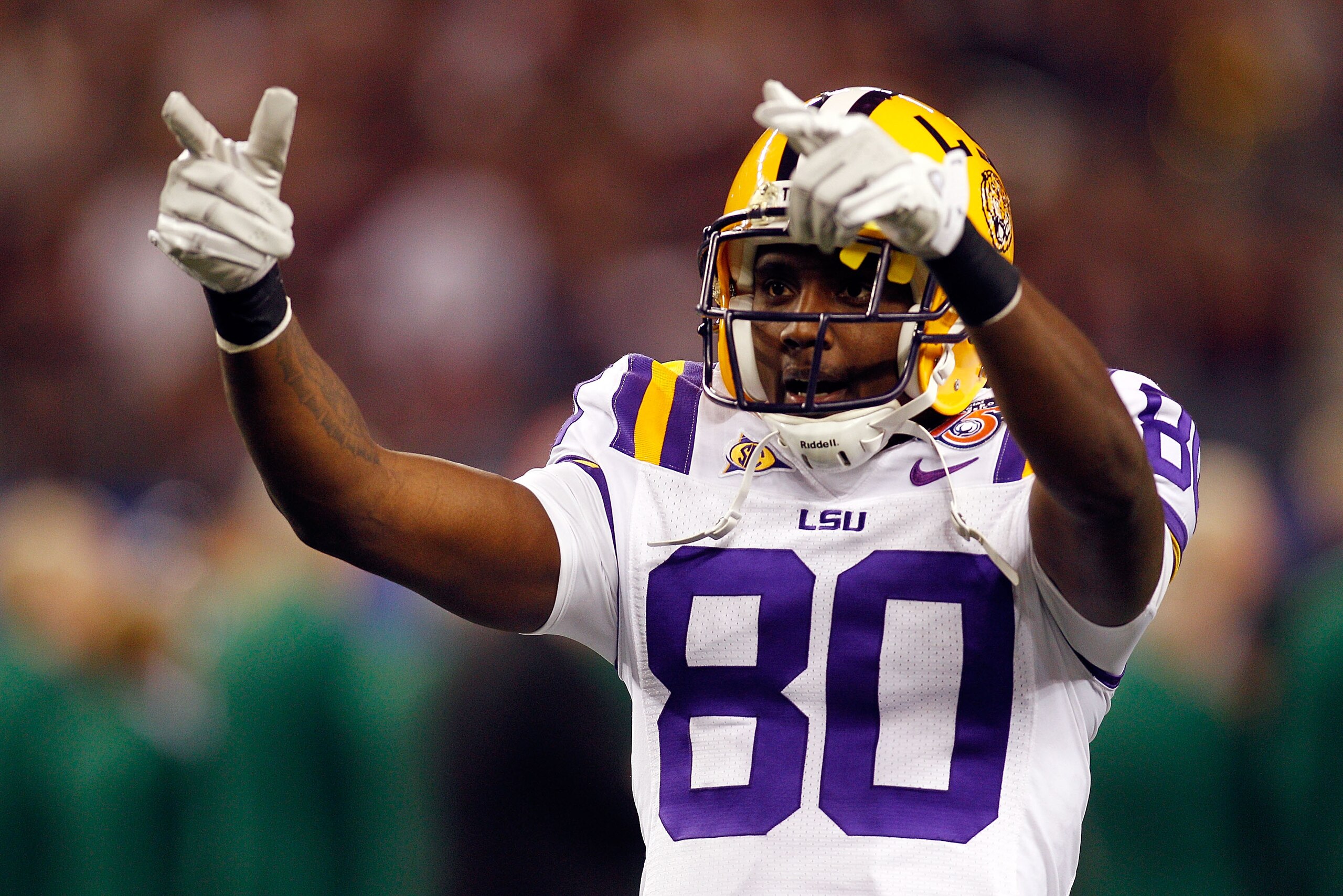 ARLINGTON, TX - JANUARY 07: Terrence Toliver #80 of the Louisiana State University Tigers points to the crowd during pregame before playing the Texas A&M Aggies during the AT&T Cotton Bowl at Cowboys Stadium on January 7, 2011 in Arlington, Texas. (Phot ARLINGTON, TX - JANUARY 07: Terrence Toliver #80 of the Louisiana State University Tigers points to the crowd during pregame before playing the Texas A&M Aggies during the AT&T Cotton Bowl at Cowboys Stadium on January 7, 2011 in Arlington, Texas. (Phot