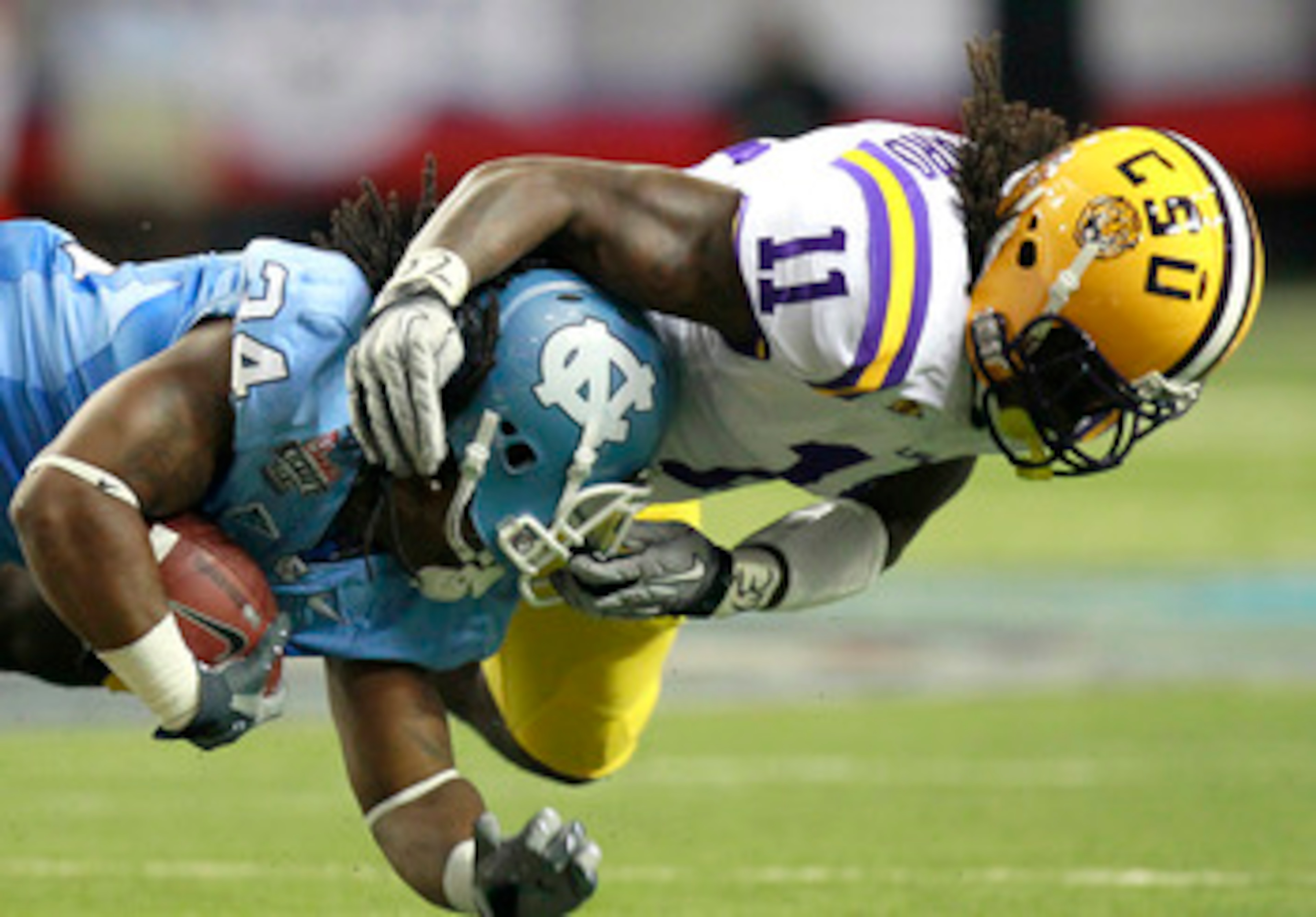 ATLANTA - SEPTEMBER 4: Kelvin Sheppard #11 of the LSU Tigers tackles Johnny White #34 of the North Carolina Tar Heels at the Georgia Dome September 4, 2010 in Atlanta, Georgia.  (Photo by Kevin C. Cox/Getty Images)