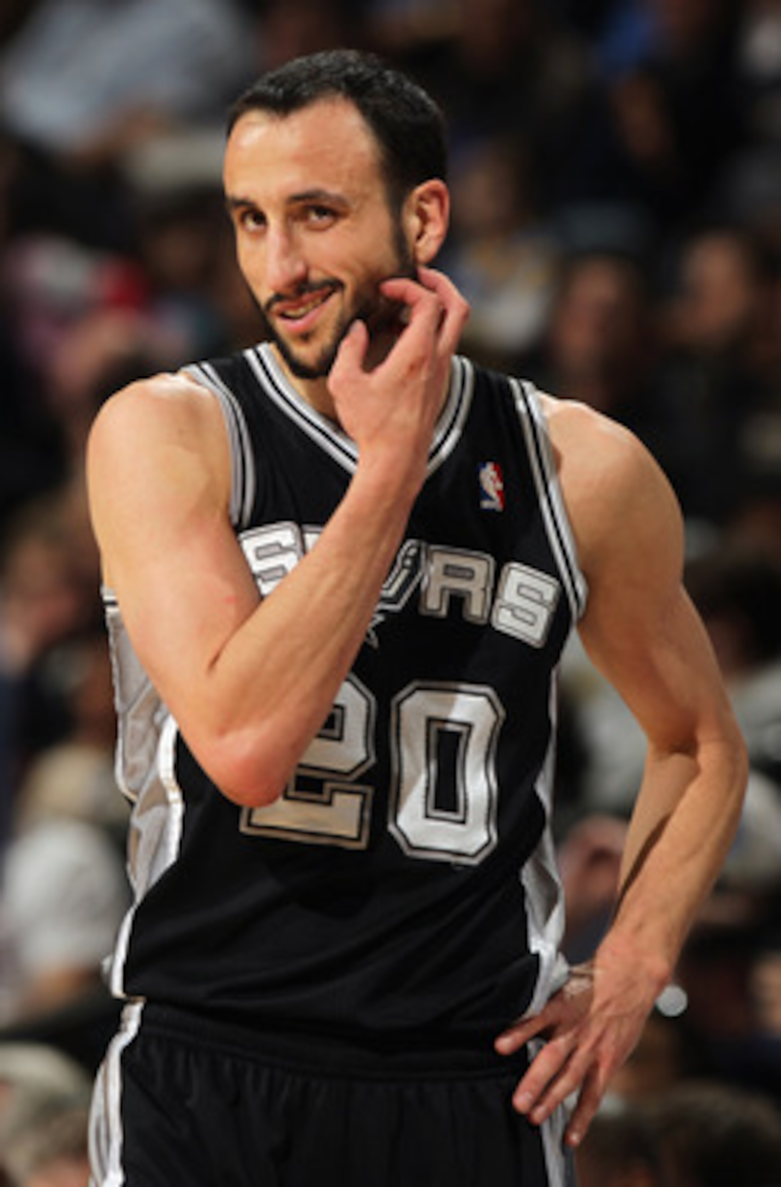 DENVER, CO - MARCH 23: Manu Ginobili #20 of the San Antonio Spurs looks on during a break in the against the Denver Nuggets at the Pepsi Center on March 23, 2011 in Denver, Colorado. The Nuggets defeated the Spurs 115-112. NOTE TO USER: User expressly ac DENVER, CO - MARCH 23: Manu Ginobili #20 of the San Antonio Spurs looks on during a break in the against the Denver Nuggets at the Pepsi Center on March 23, 2011 in Denver, Colorado. The Nuggets defeated the Spurs 115-112. NOTE TO USER: User expressly ac