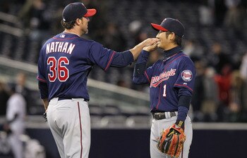NEW YORK, NY - APRIL 05: Joe Nathan #36 of the Minnesota Twins celebrates the win with Tsuyoshi Nishioka #1 against the New York Yankees at Yankee Stadium on April 5, 2011 in the Bronx borough of New York City. (Photo by Nick Laham/Getty Images) NEW YORK, NY - APRIL 05: Joe Nathan #36 of the Minnesota Twins celebrates the win with Tsuyoshi Nishioka #1 against the New York Yankees at Yankee Stadium on April 5, 2011 in the Bronx borough of New York City. (Photo by Nick Laham/Getty Images)